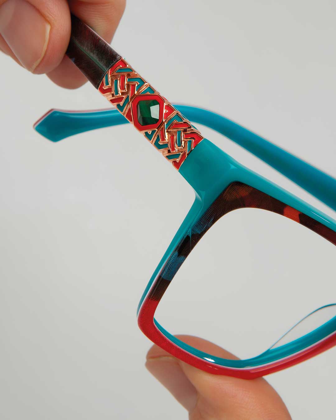A pair of glasses with a vibrant and artistic design, adding a pop of color to any outfit.