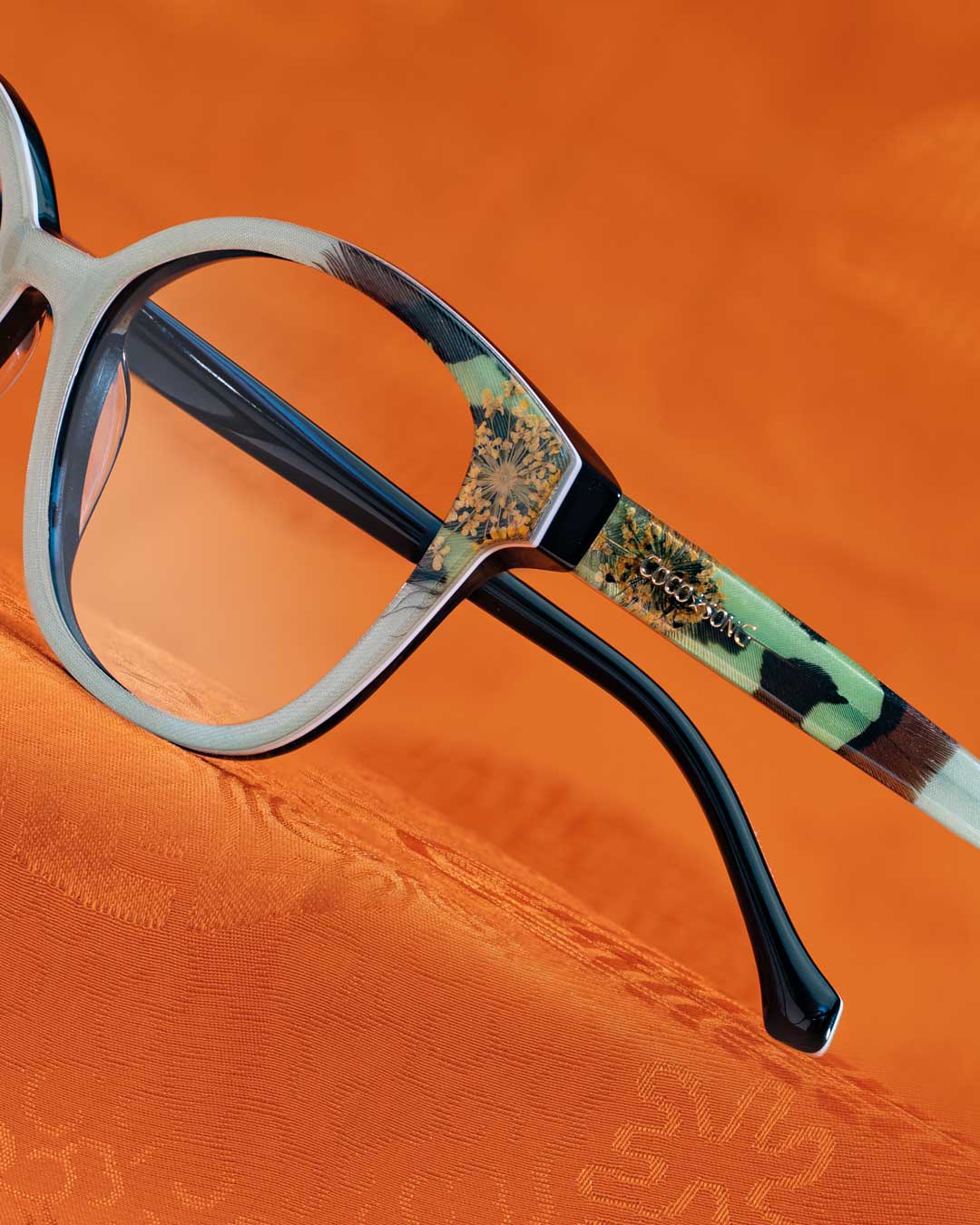 Stylish glasses with red and yellow pattern, perfect for adding a pop of color to your look.