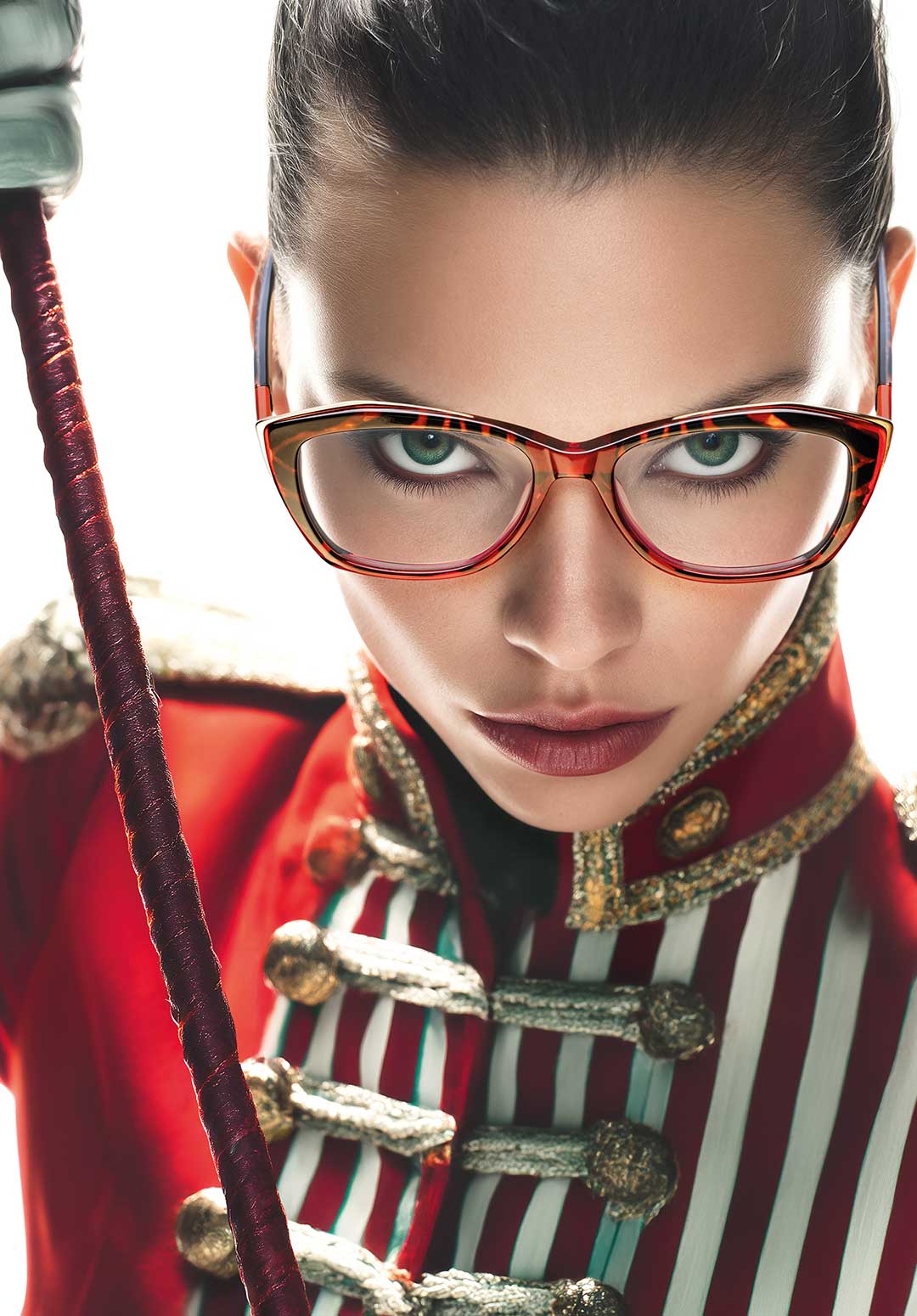 Elegant woman in glasses La Matta and head scarf exudes sophistication and grace.