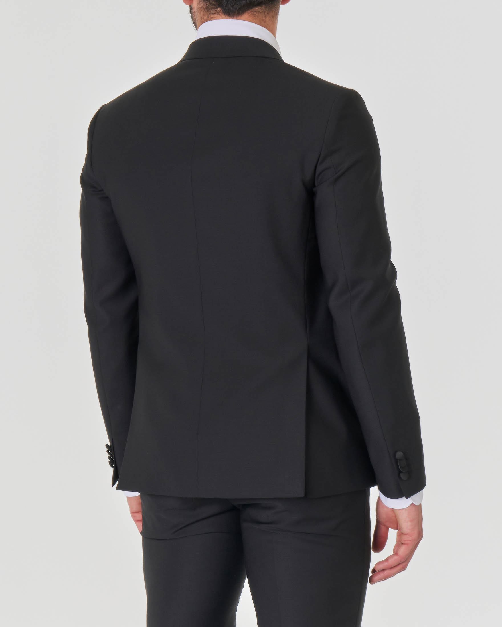 Abito smoking nero in tela di lana stretch