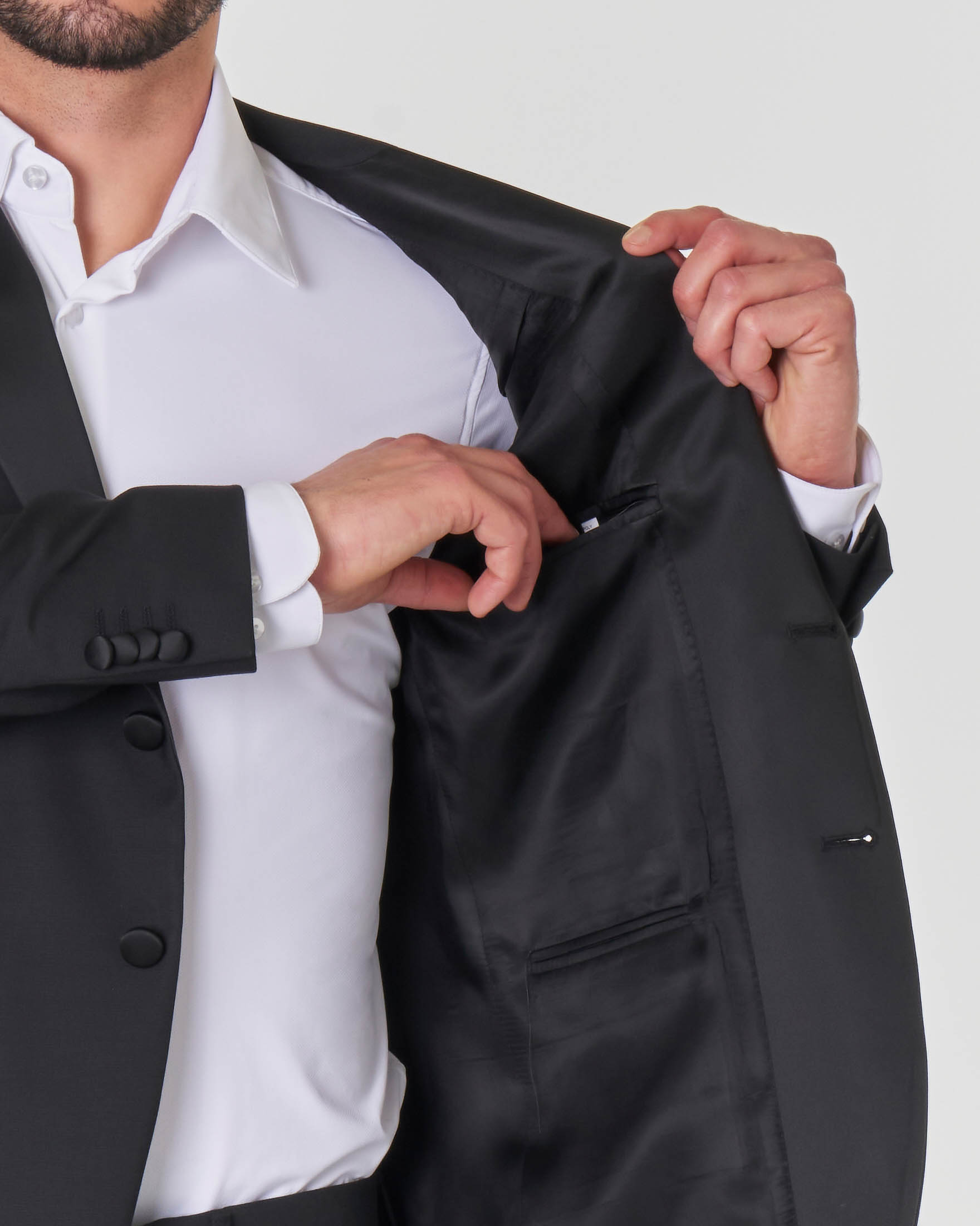 Abito smoking nero in tela di lana stretch