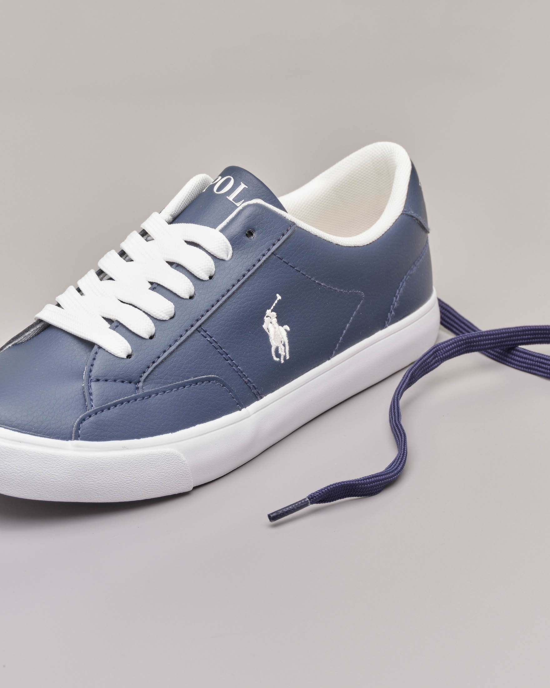Sneakers blu in ecopelle con pony bianco 35-39