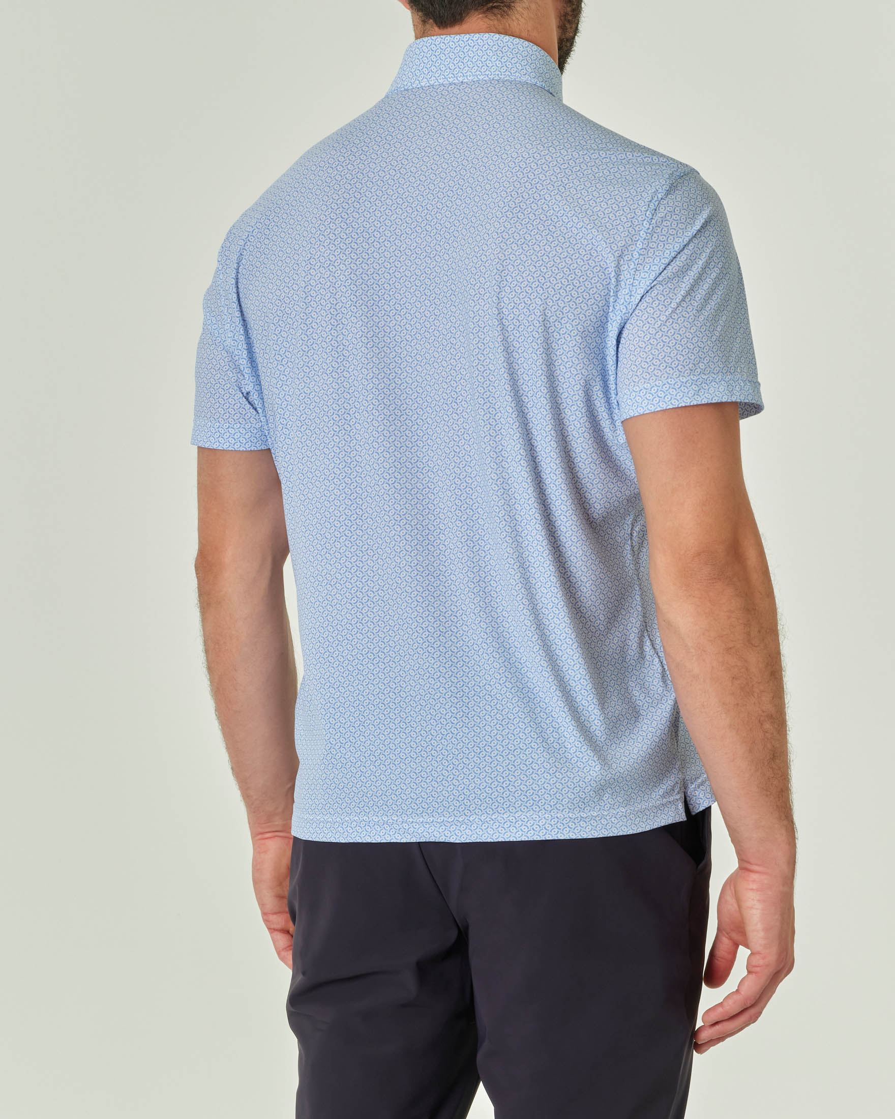 Polo micro fantasia bianca e azzurra in tessuto tecnico hyper comfort