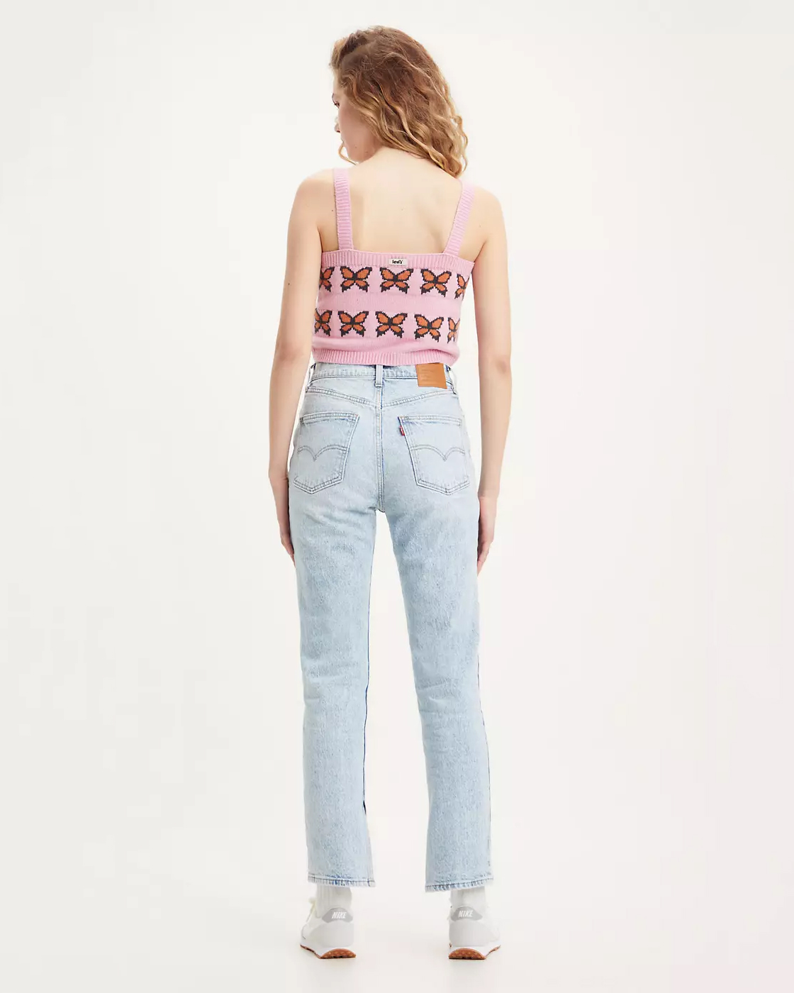Crop top in maglia rosa di misto cotone con farfalle jacquard ricamate
