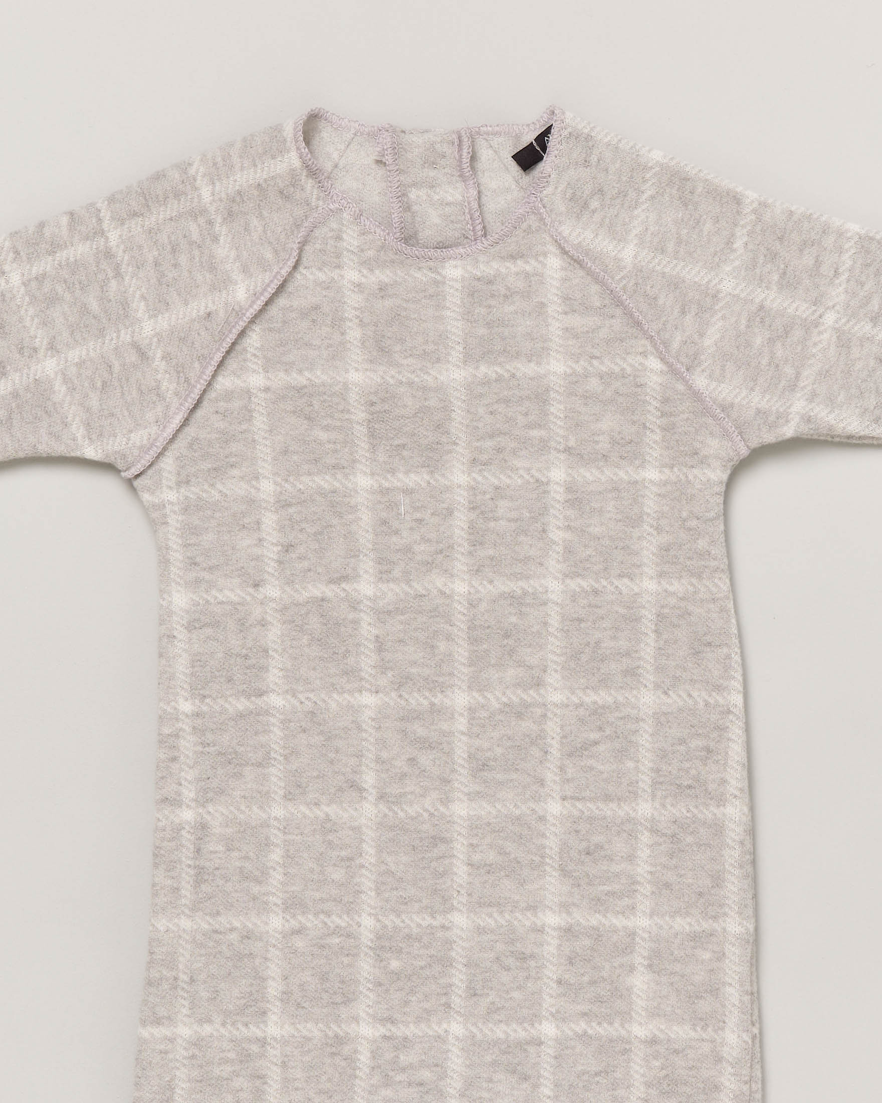 Tutina grigia in fantasia finestrata con manica raglan 3-9 mesi