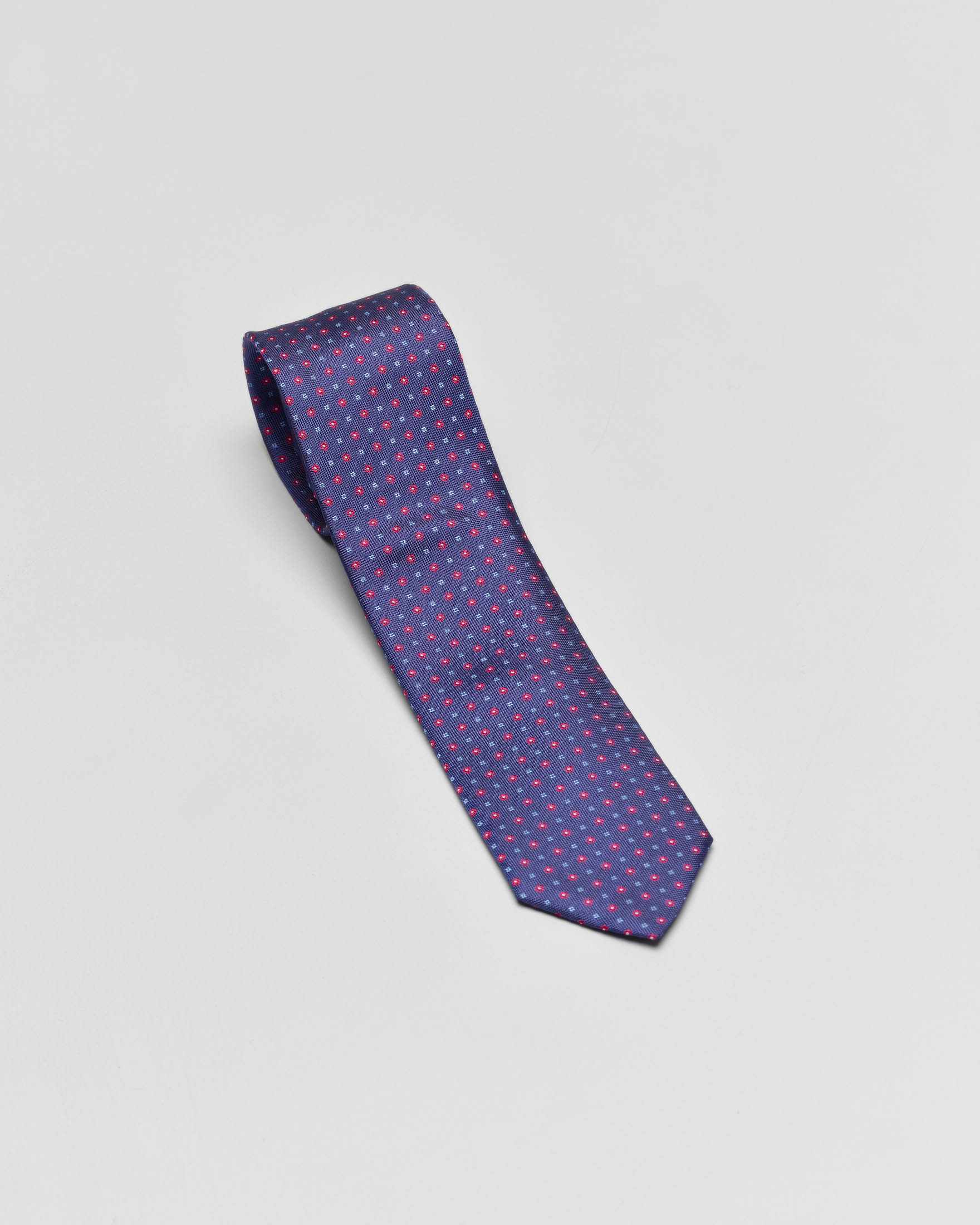 Cravatta blu indaco micro fantasia blu royal e rossa in pura seta