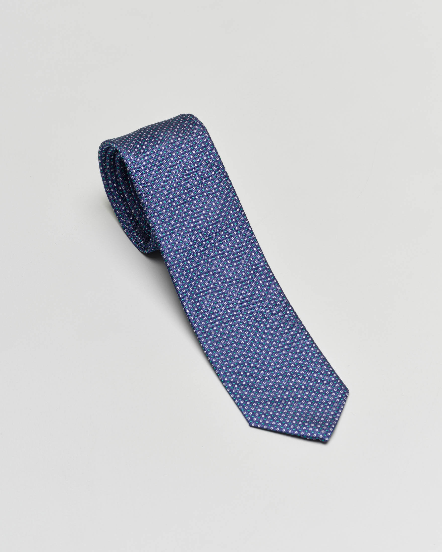 Cravatta blu micro fantasia verde e bianca in pura seta