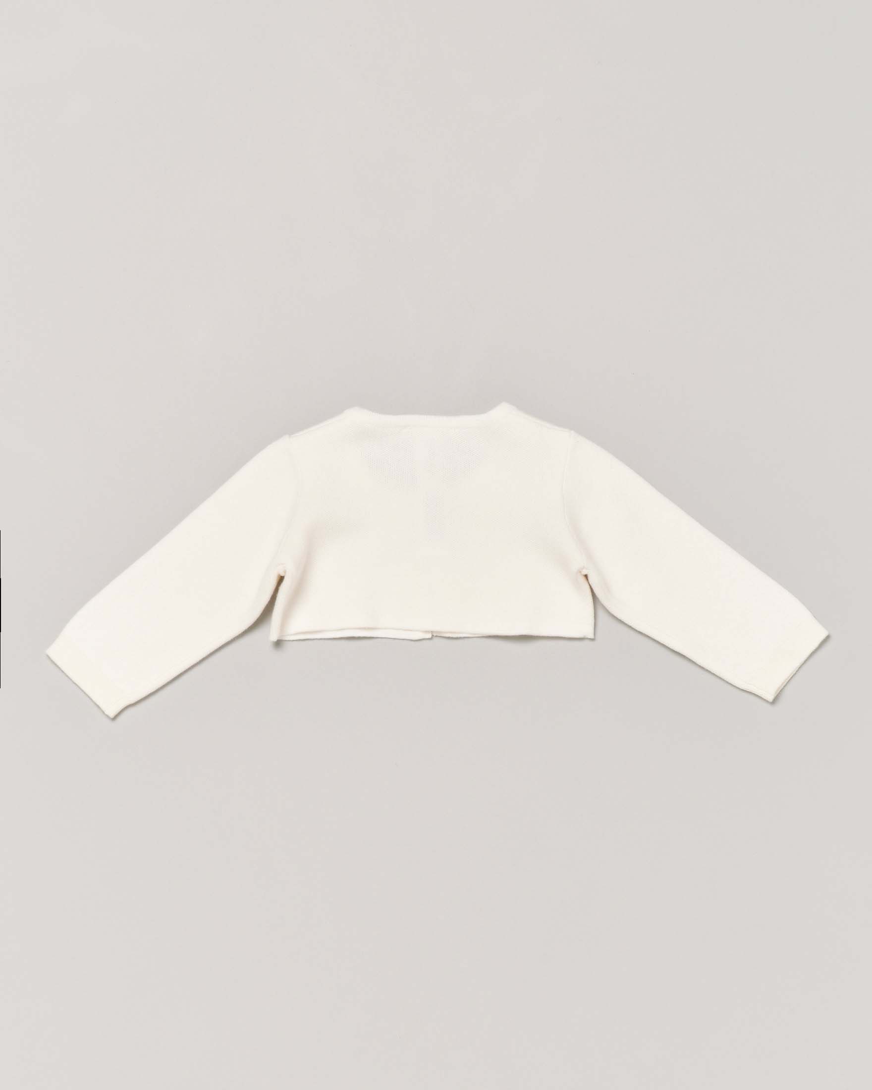 Bolero avorio in maglia di cotone con bottoncino e placchetta porta logo oro 9-48 mesi