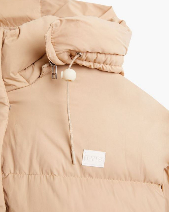 Piumino puffy beige con cappuccio staccabile image