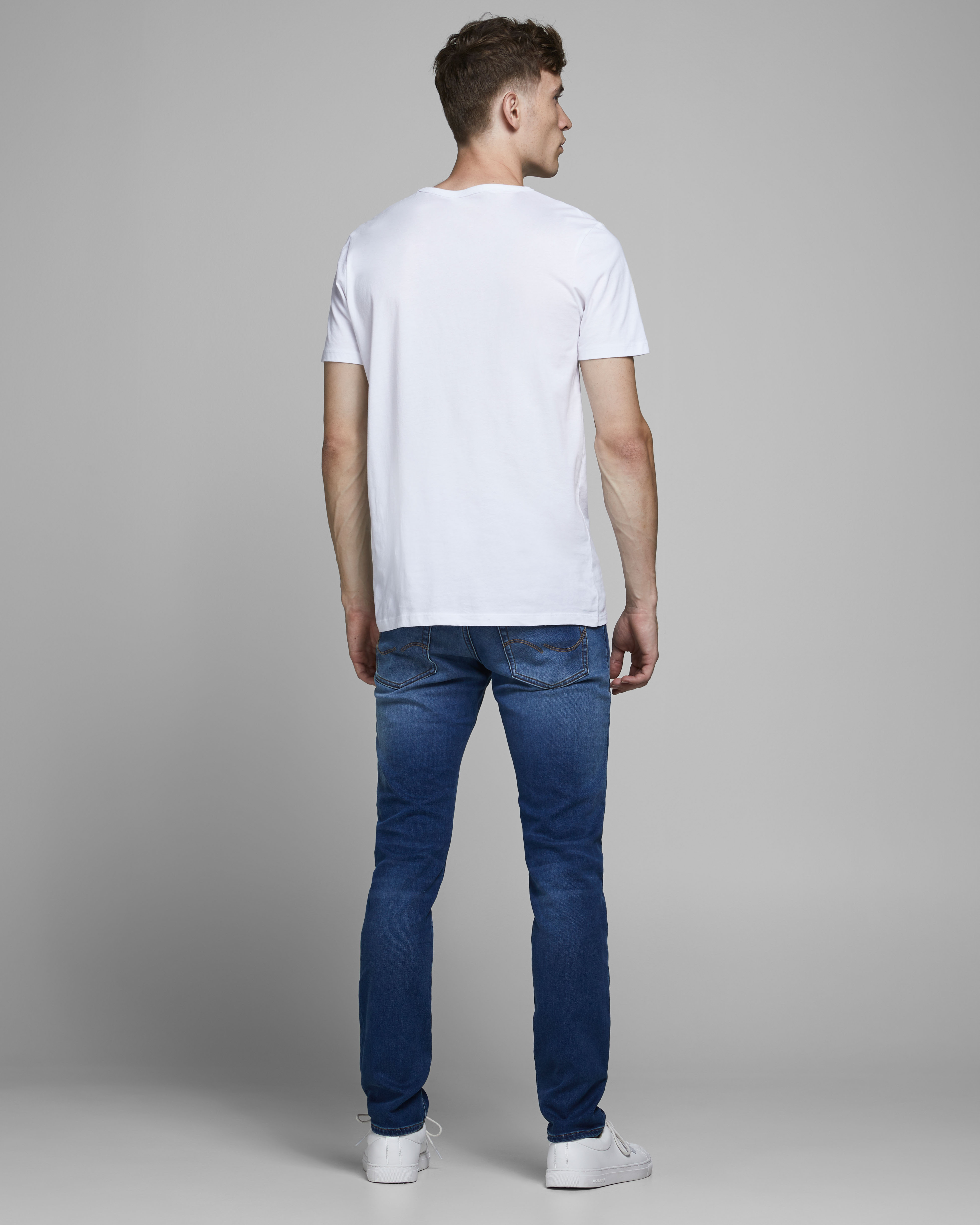 Jeans Glenn slim fit in cotone stretch lavaggio medio stone washed con baffature image