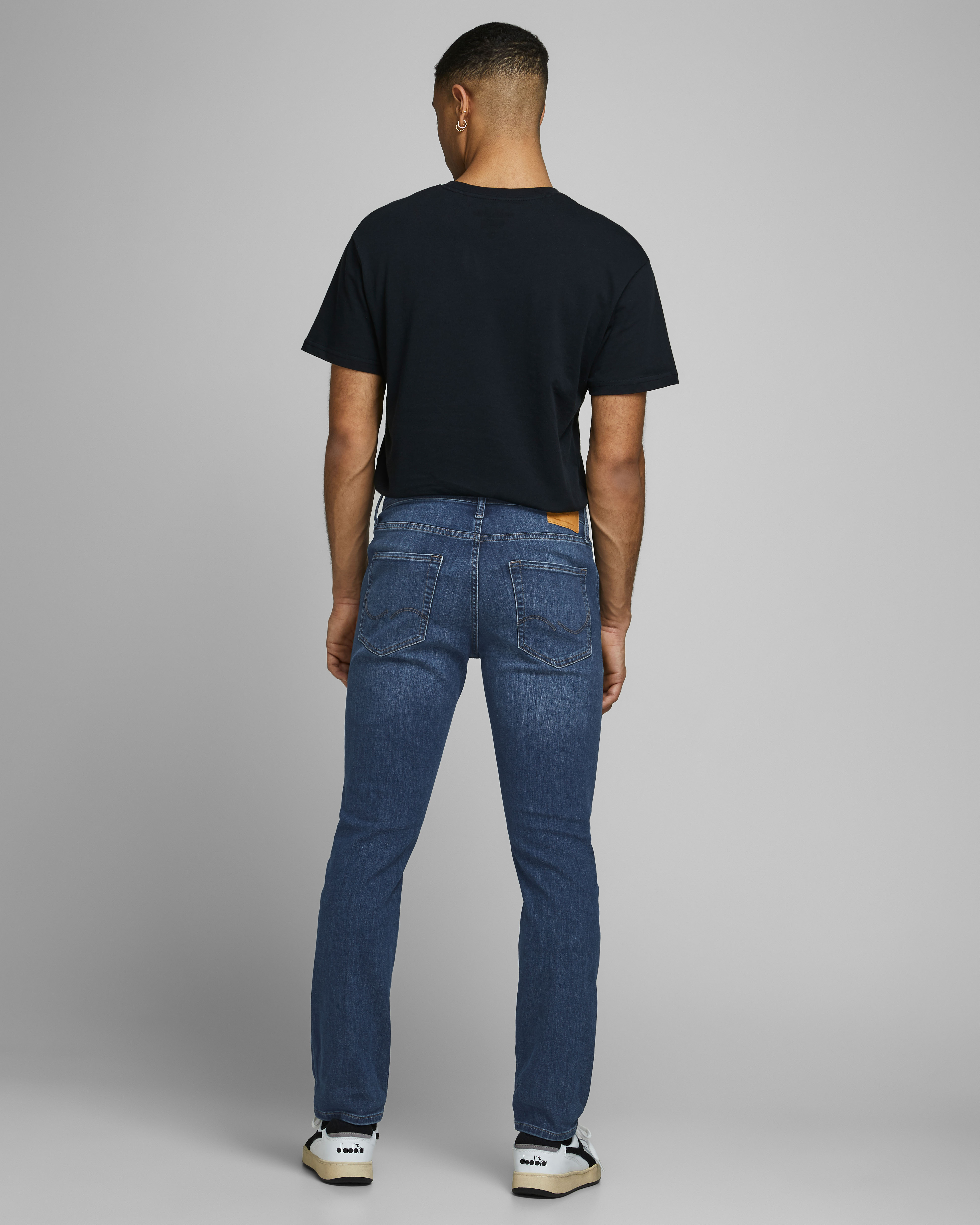 Jeans Glenn slim fit in cotone stretch lavaggio medio stone washed con baffature image