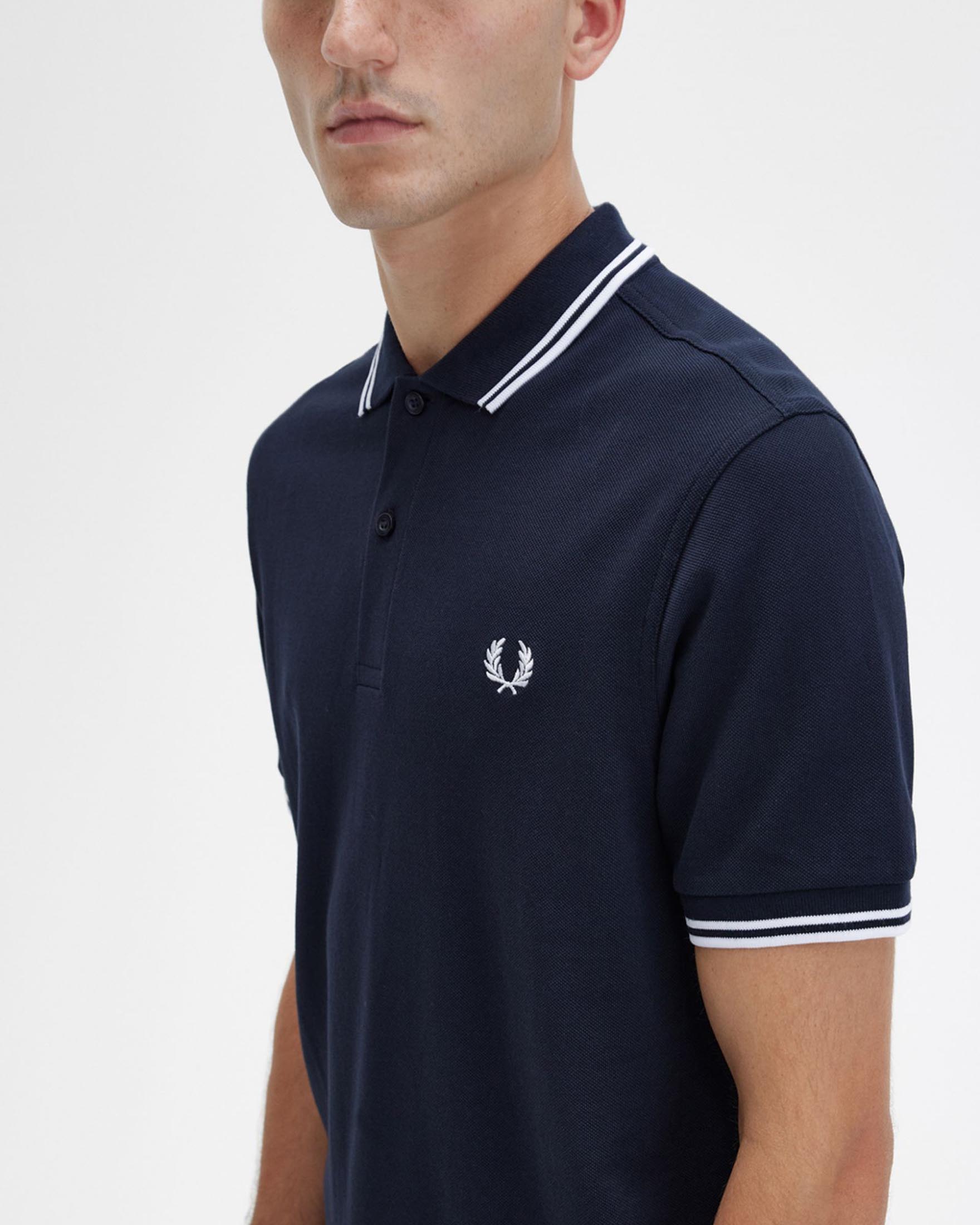 Polo mezza manica blu con bordino bianco image