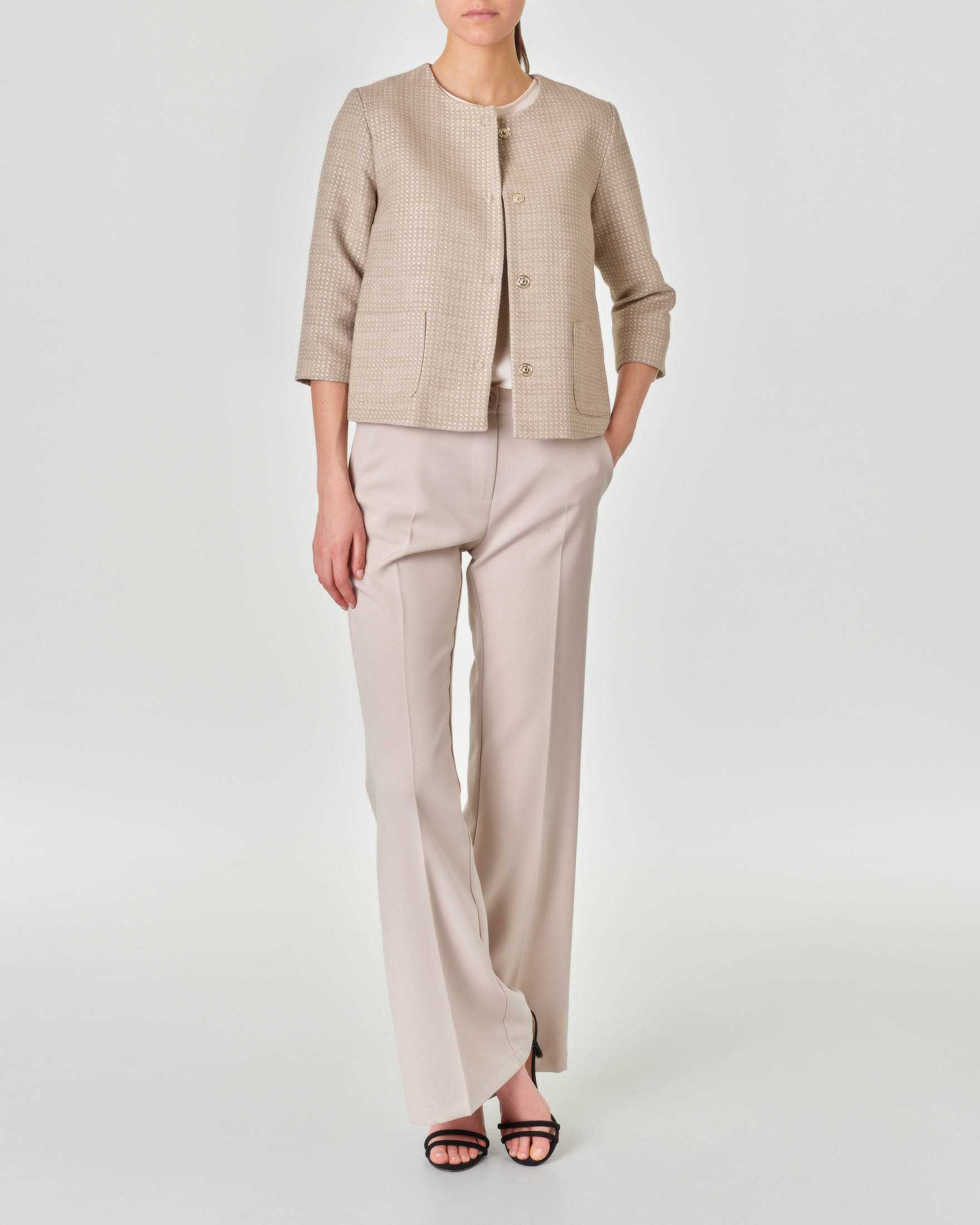 Giacca color beige senza collo in misto cotone effetto semi lucido con disegni effetto intreccio image