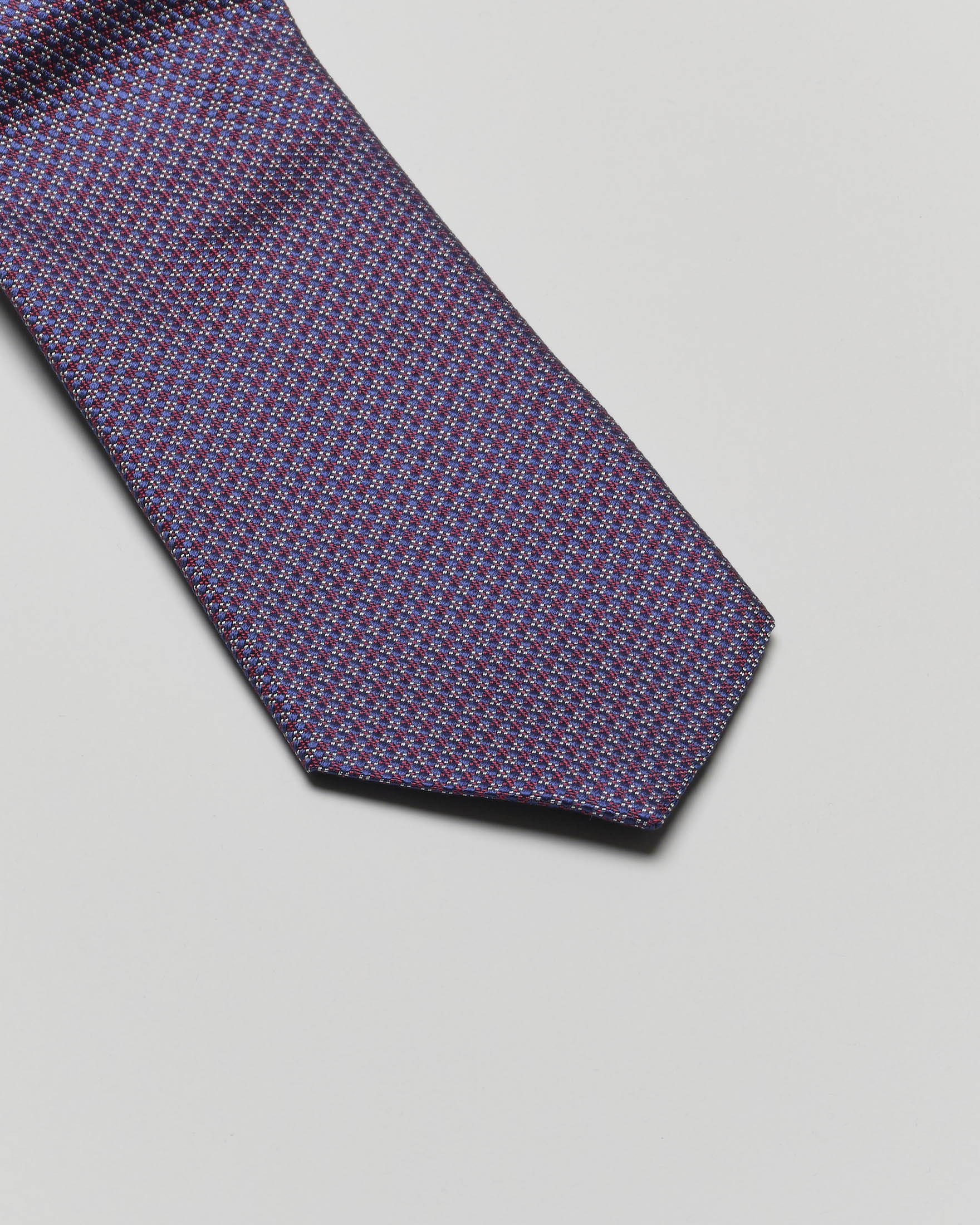 Cravatta blu e bordeaux micro fantasia di pura seta Pellizzari