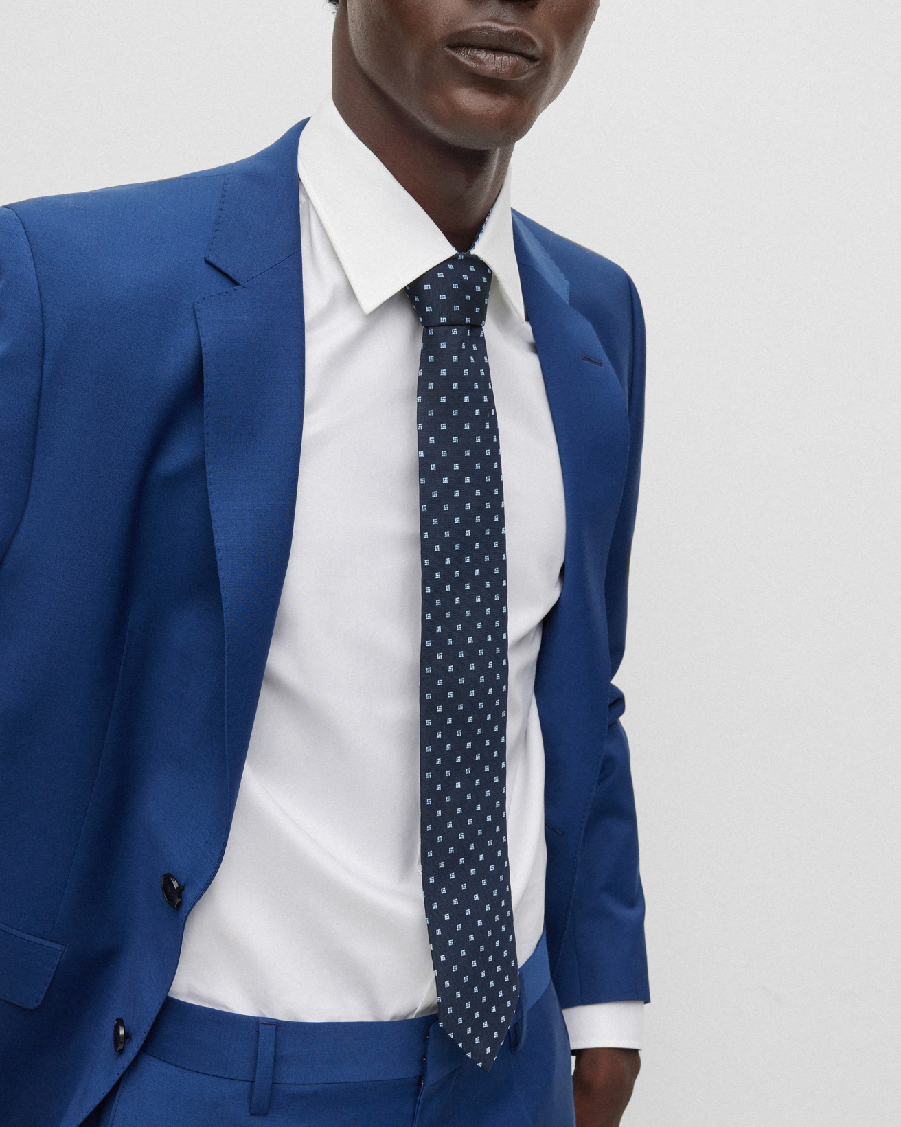 Cravatta blu con micro fantasia azzurra in seta