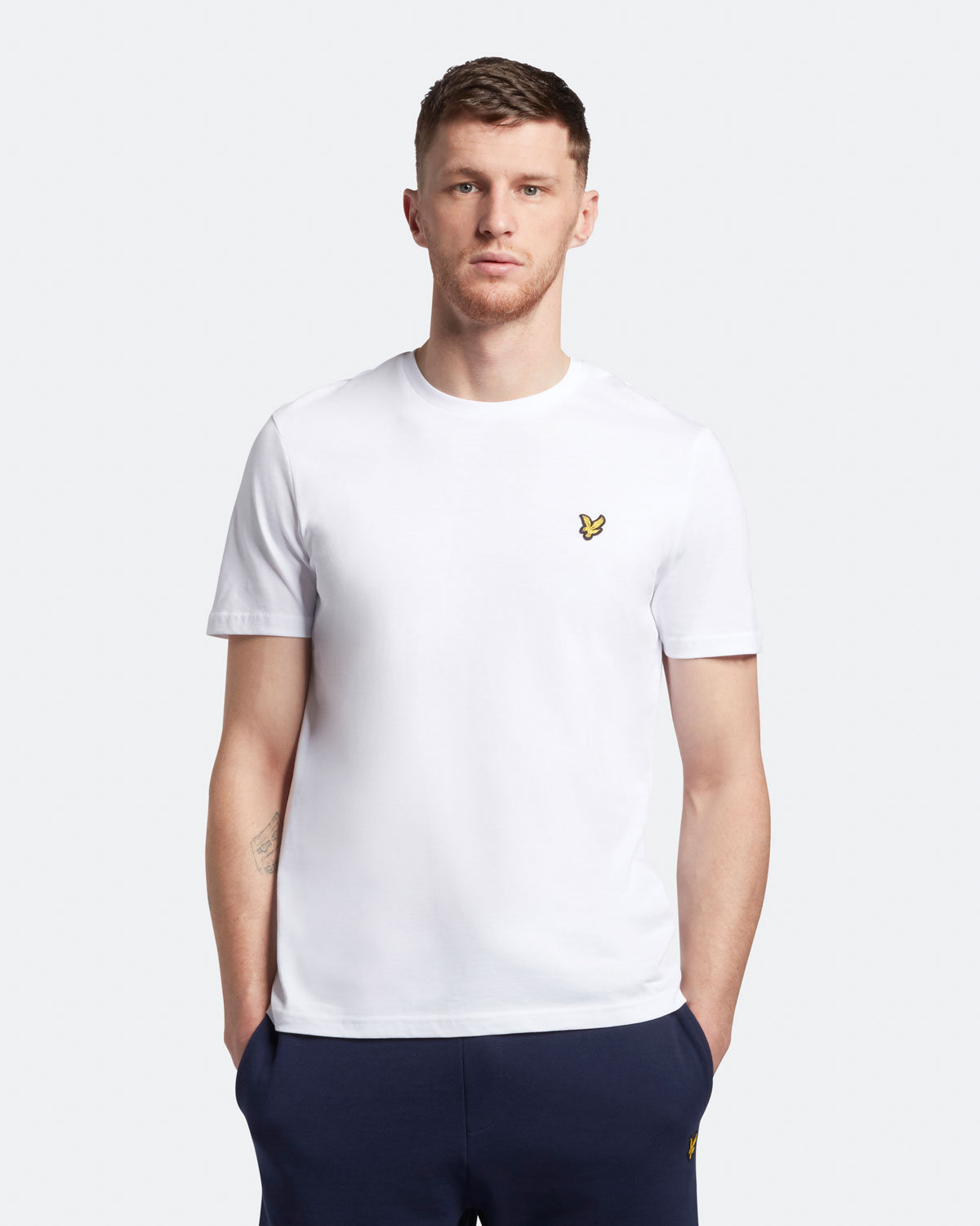 T-shirt mezza manica bianca in cotone con logo aquila gialla ricamata sul petto