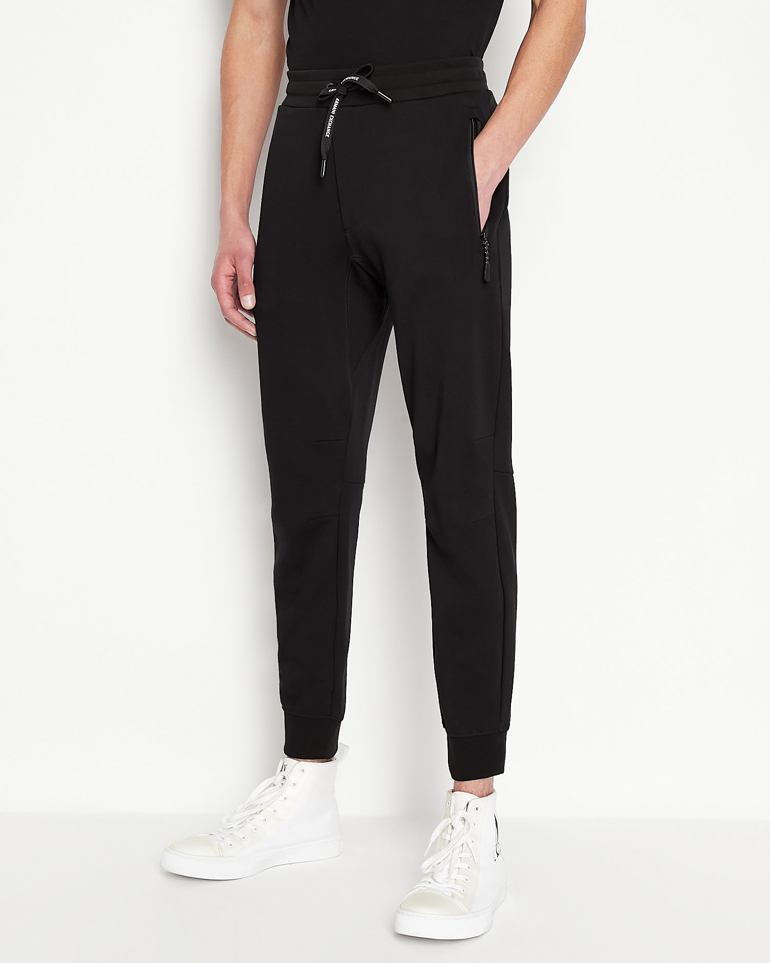 Pantalone nero in felpa con tasche con cerniera