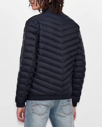 Piumino blu senza cappuccio con trapuntatura diagonale image