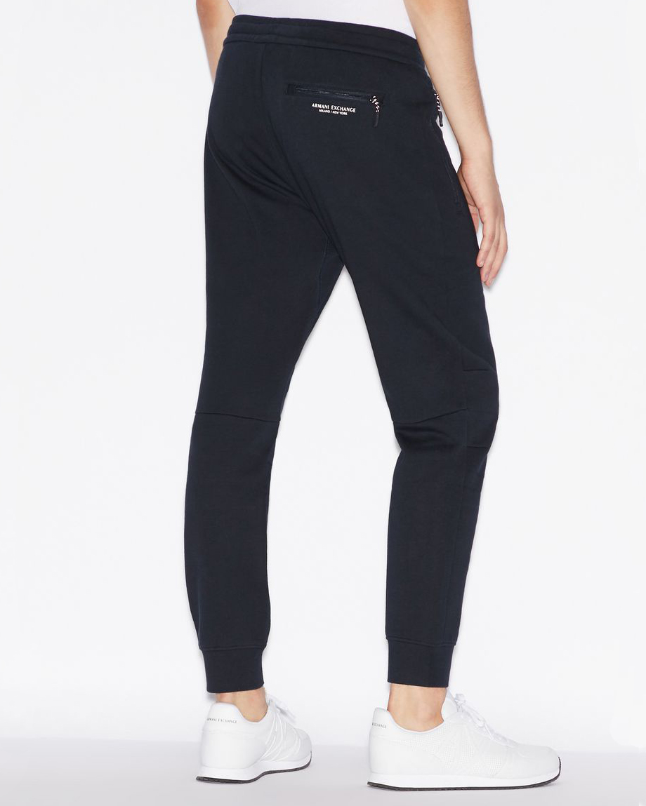 Pantalone blu in felpa con tasche con cerniera image