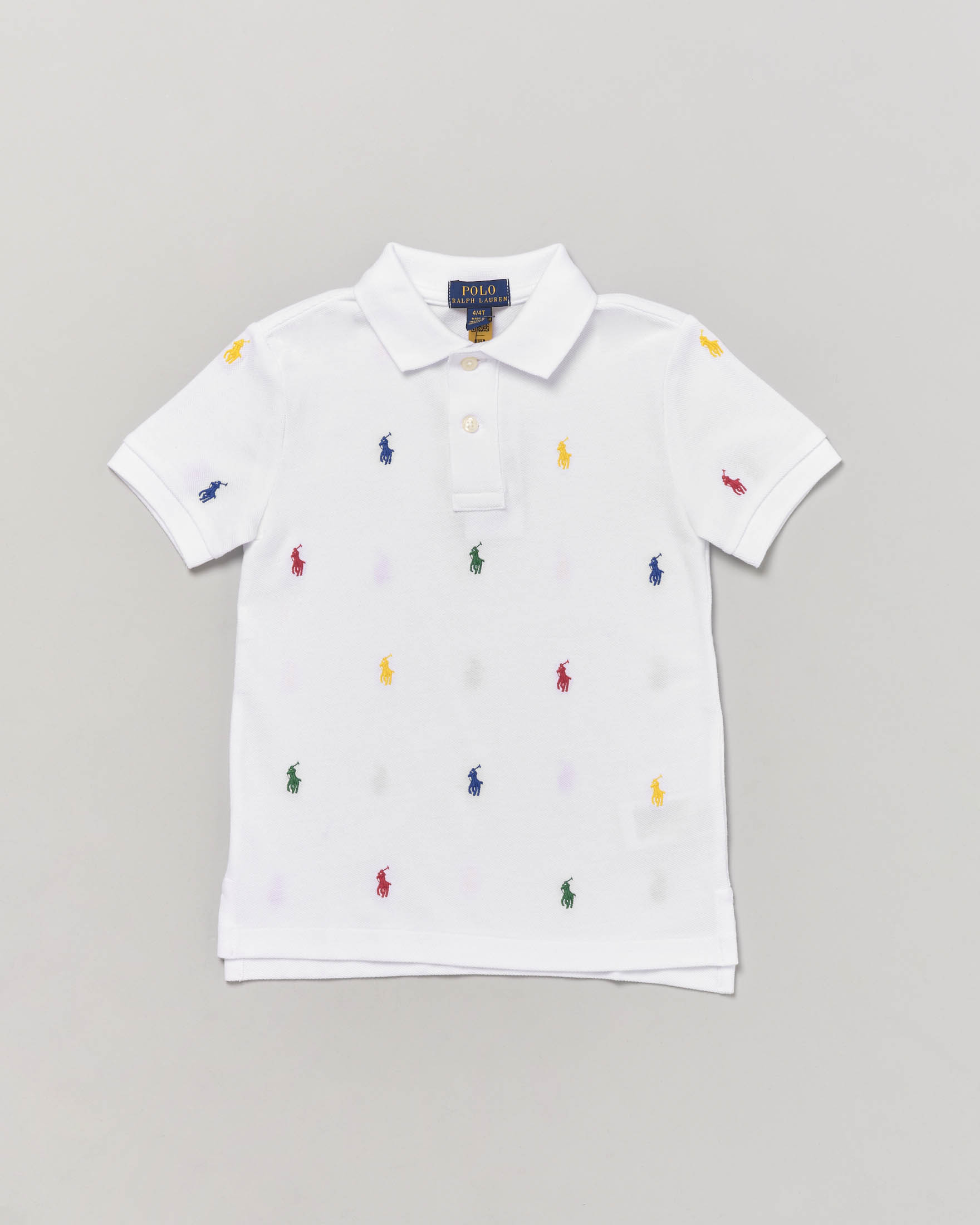 Polo bianca mezza manica in piquet di cotone con pony colorati all-over 2-7 anni