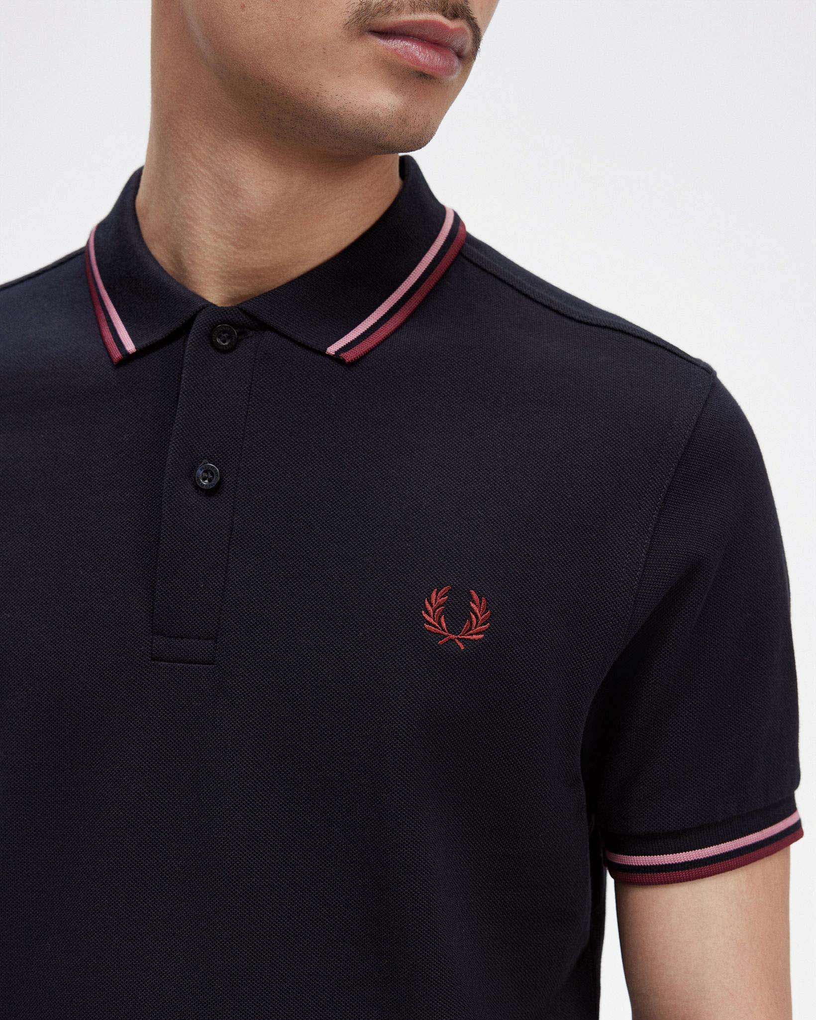 Polo mezza manica blu con bordino rosa e bordeaux image