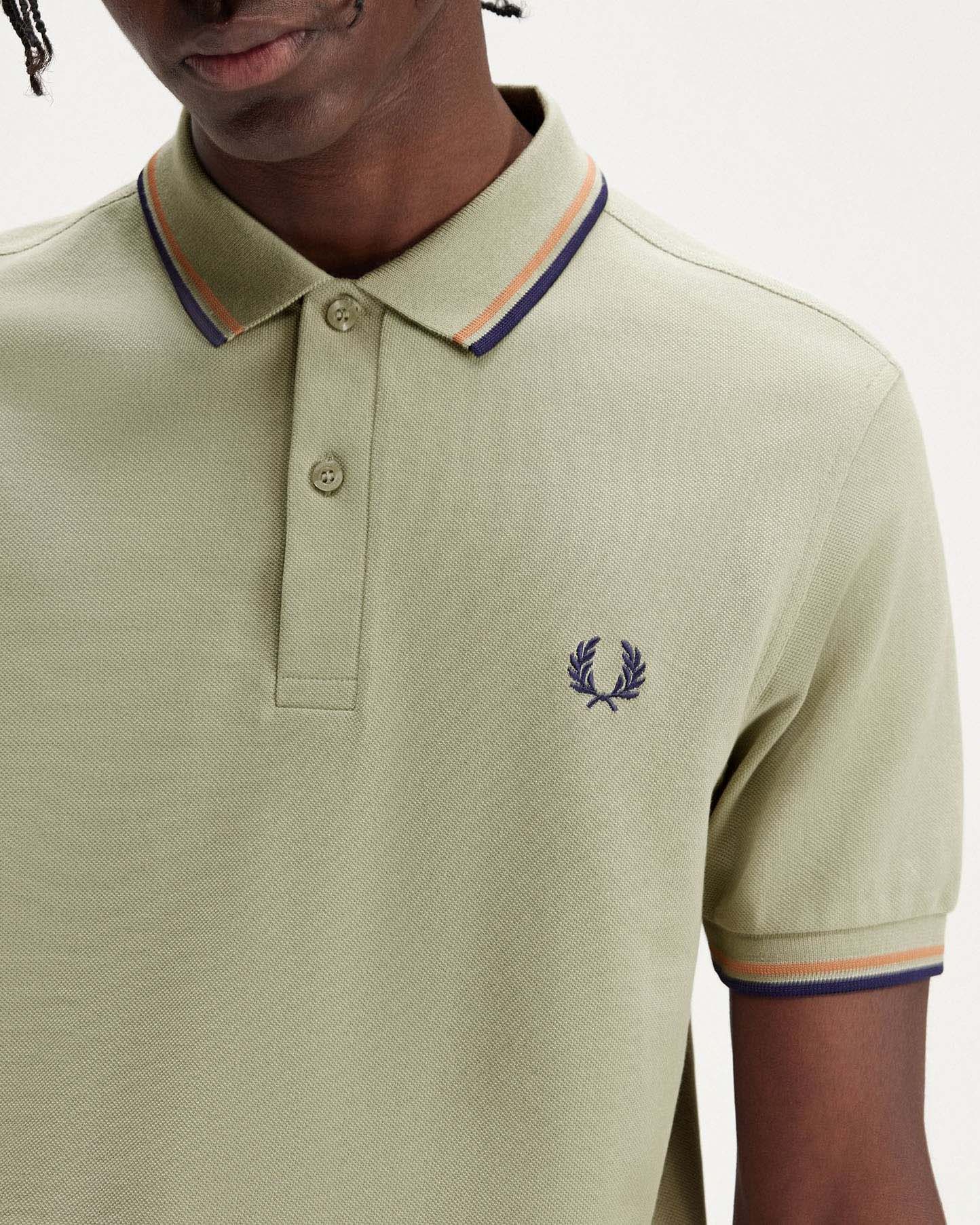 Polo beige mezza manica con bordino indaco e arancio image