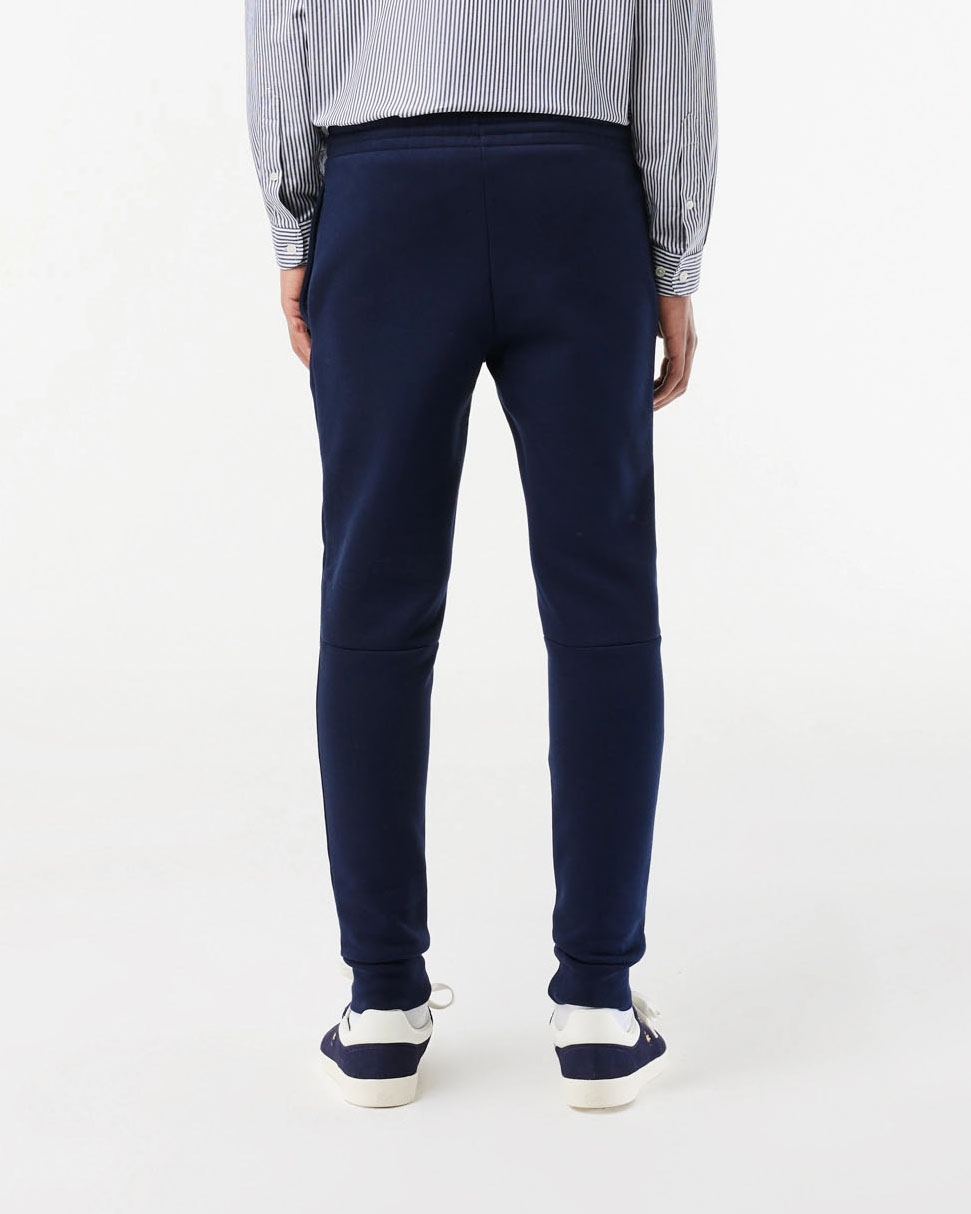 Pantaloni Lacoste blu in felpa di cotone con logo coccodrillo verde sul fianco image