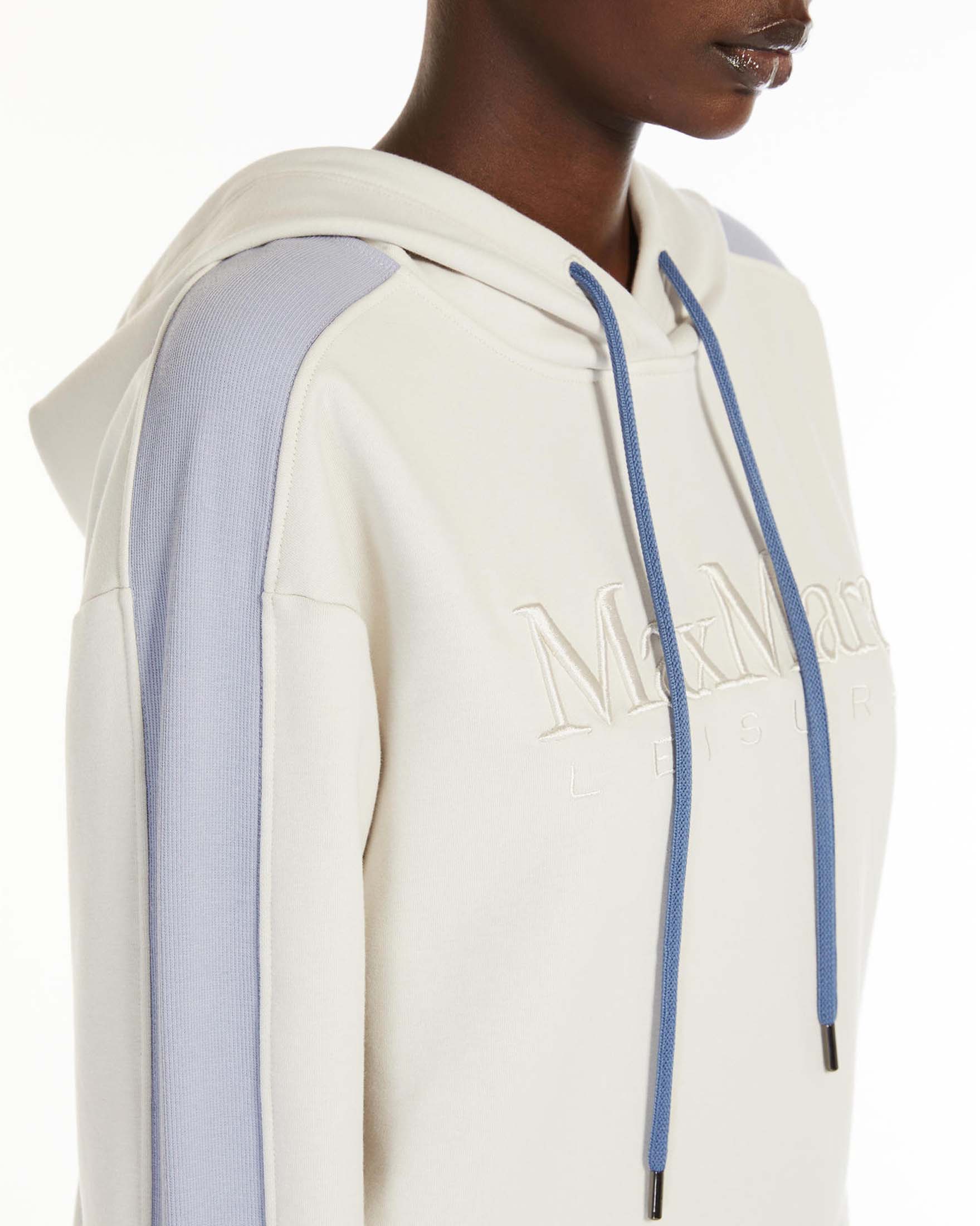 Felpa color gesso in jersey di cotone con scritta logo e bande laterali azzurre image