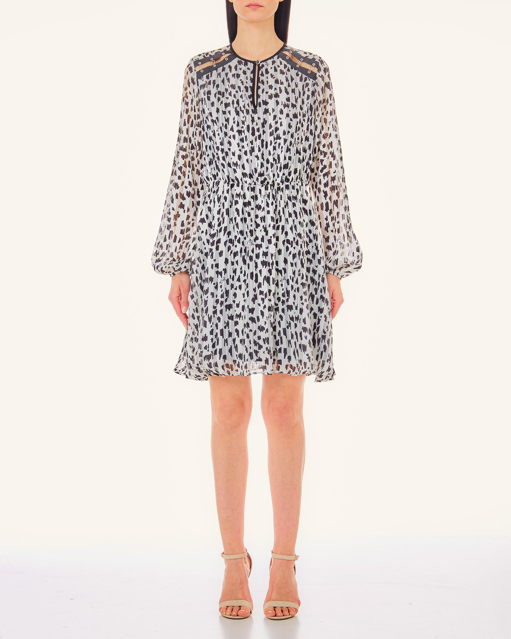 Abito corto bianco a fantasia animalier nera con inserti in pelle