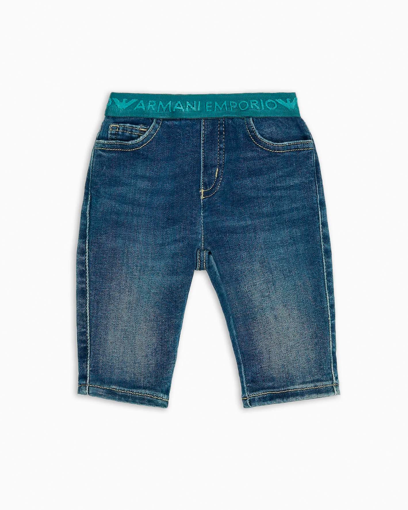 Jeans a lavaggio medio stone washed in cotone stretch con fascia elastica logata ottanio