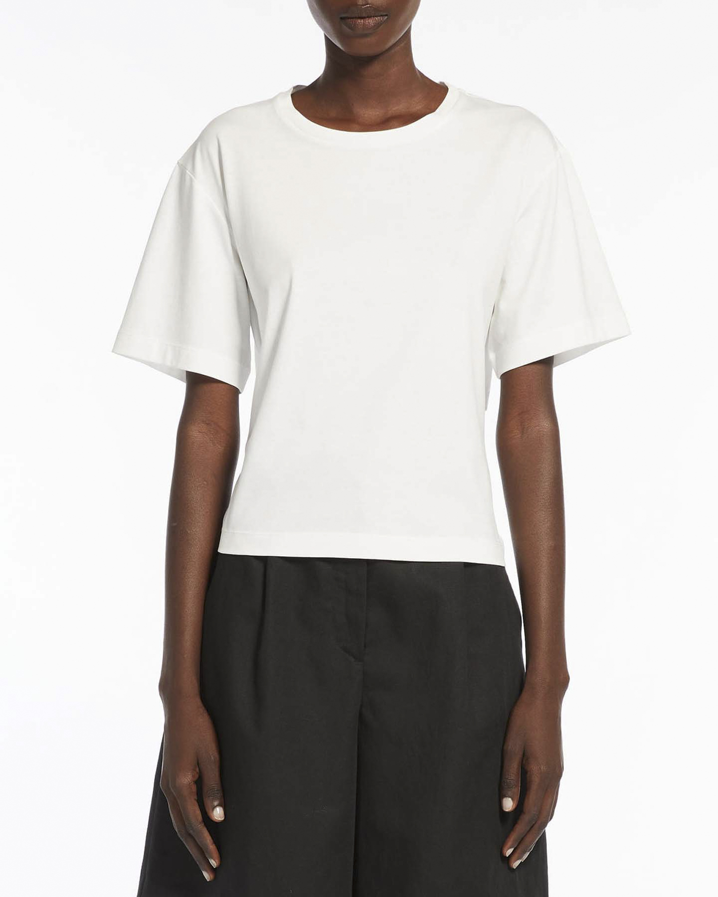 T-shirt bianca in cotone a maniche corte con schiena scollata e fiocco di chiusura