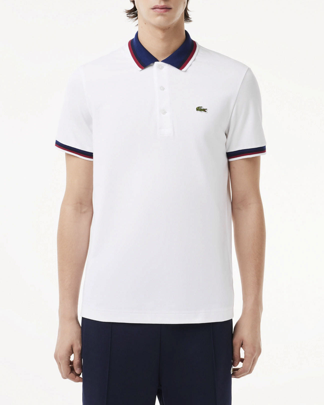 Polo bianca mezza manica in cotone stretch con collo blu e bordino in contrasto