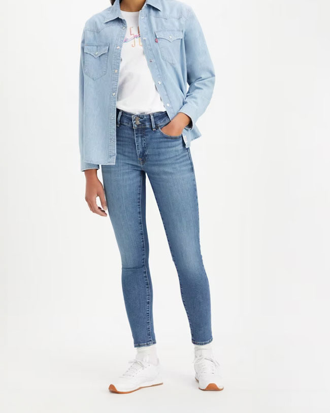 Jeans skinny blu medio in cotone stretch a vita media con schiariture lungo le gambe