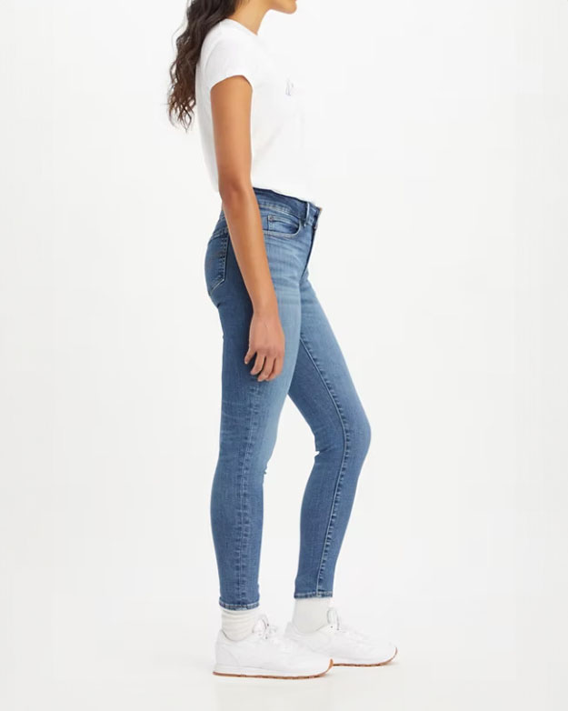 Jeans skinny blu medio in cotone stretch a vita media con schiariture lungo le gambe image