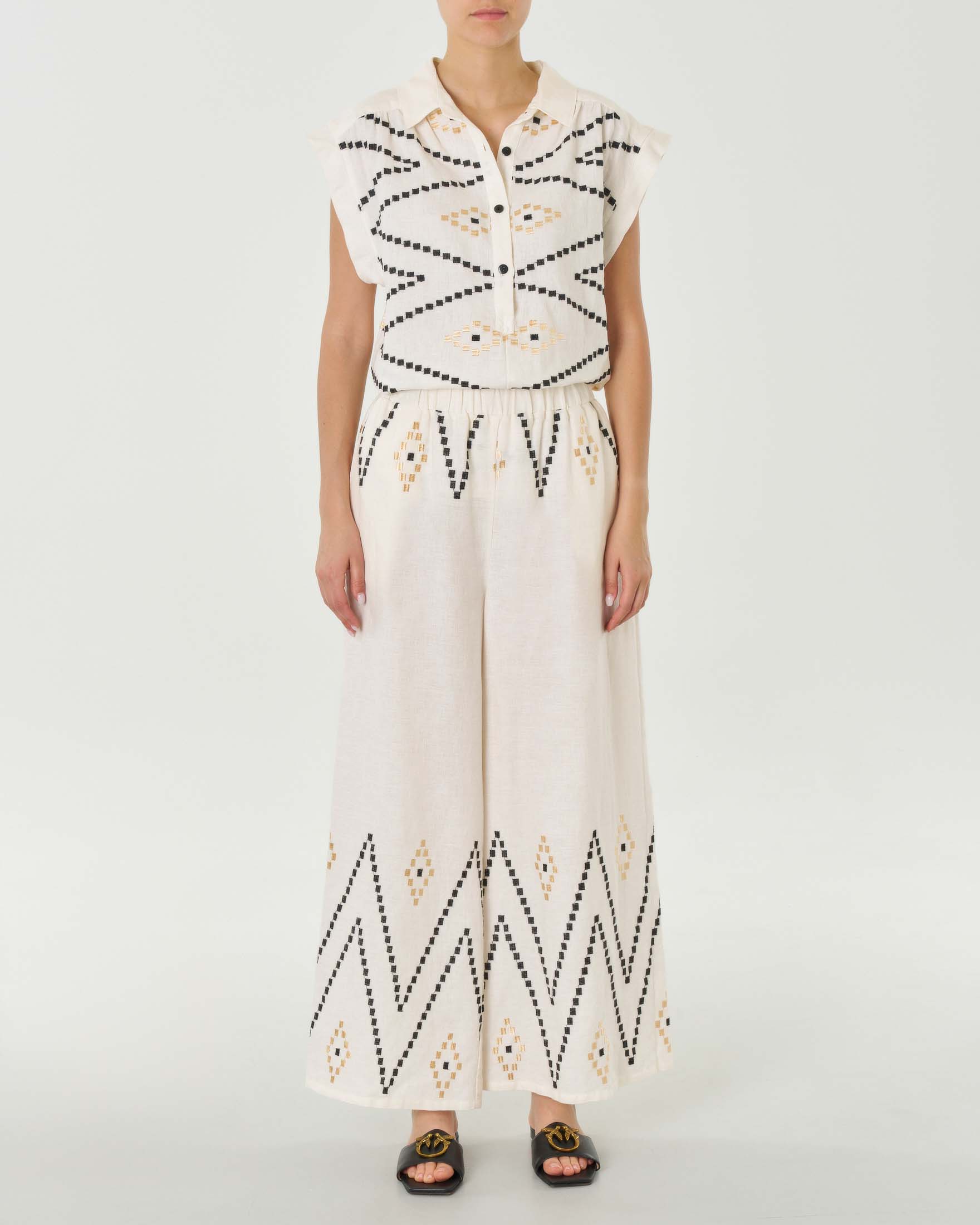 Pantaloni palazzo color naturale in lino con ricami neri e beige in vita e al fondo