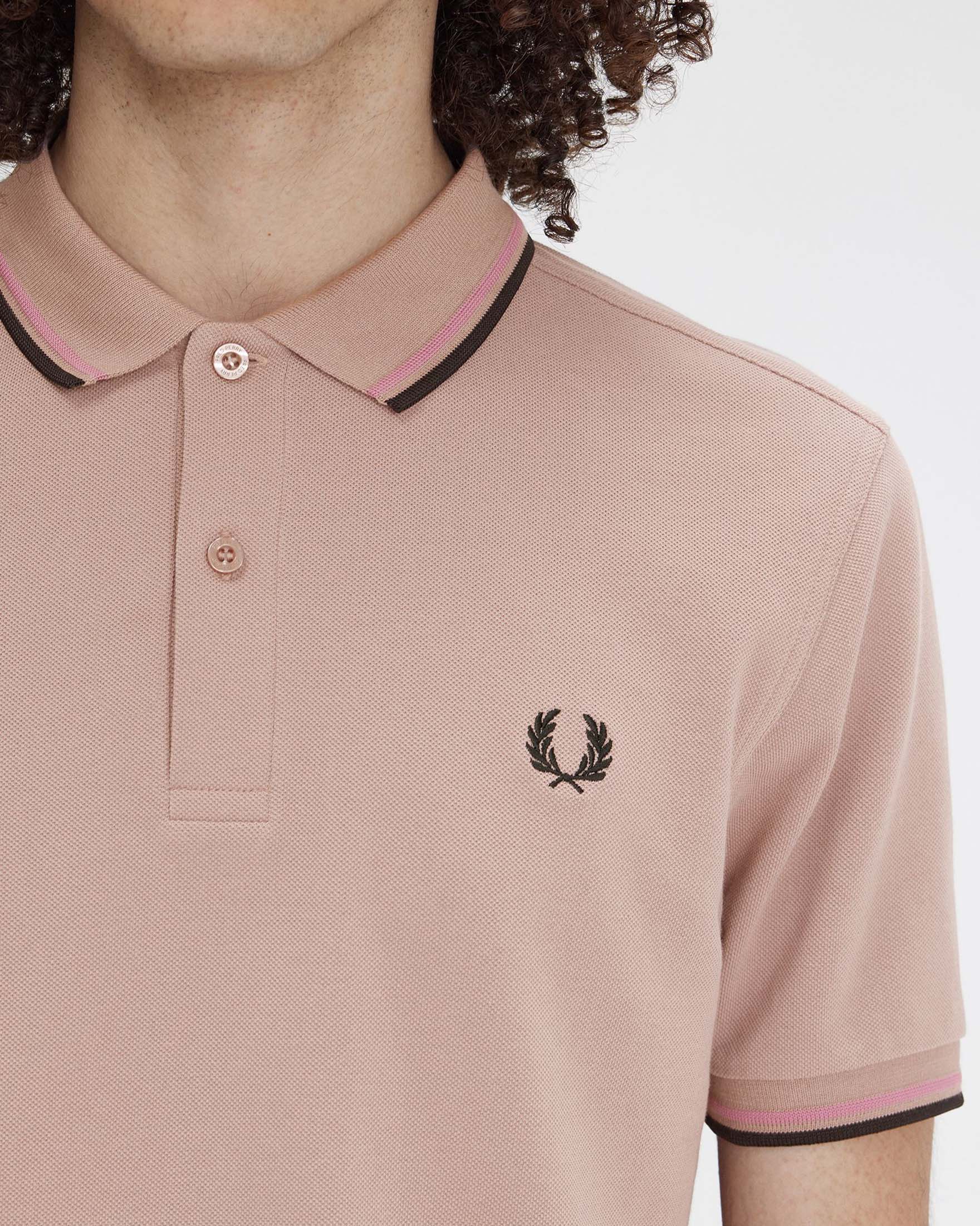 Polo mezza manica cipria con bordino rosa e nero image