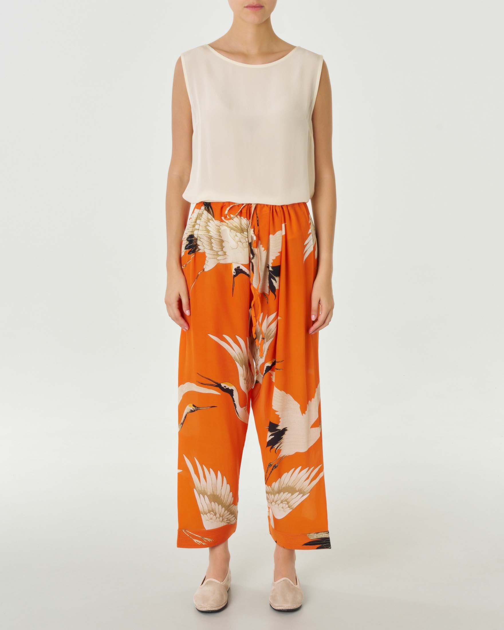 Pantaloni ampi color arancio in viscosa a fantasia cicogne con coulisse in vita