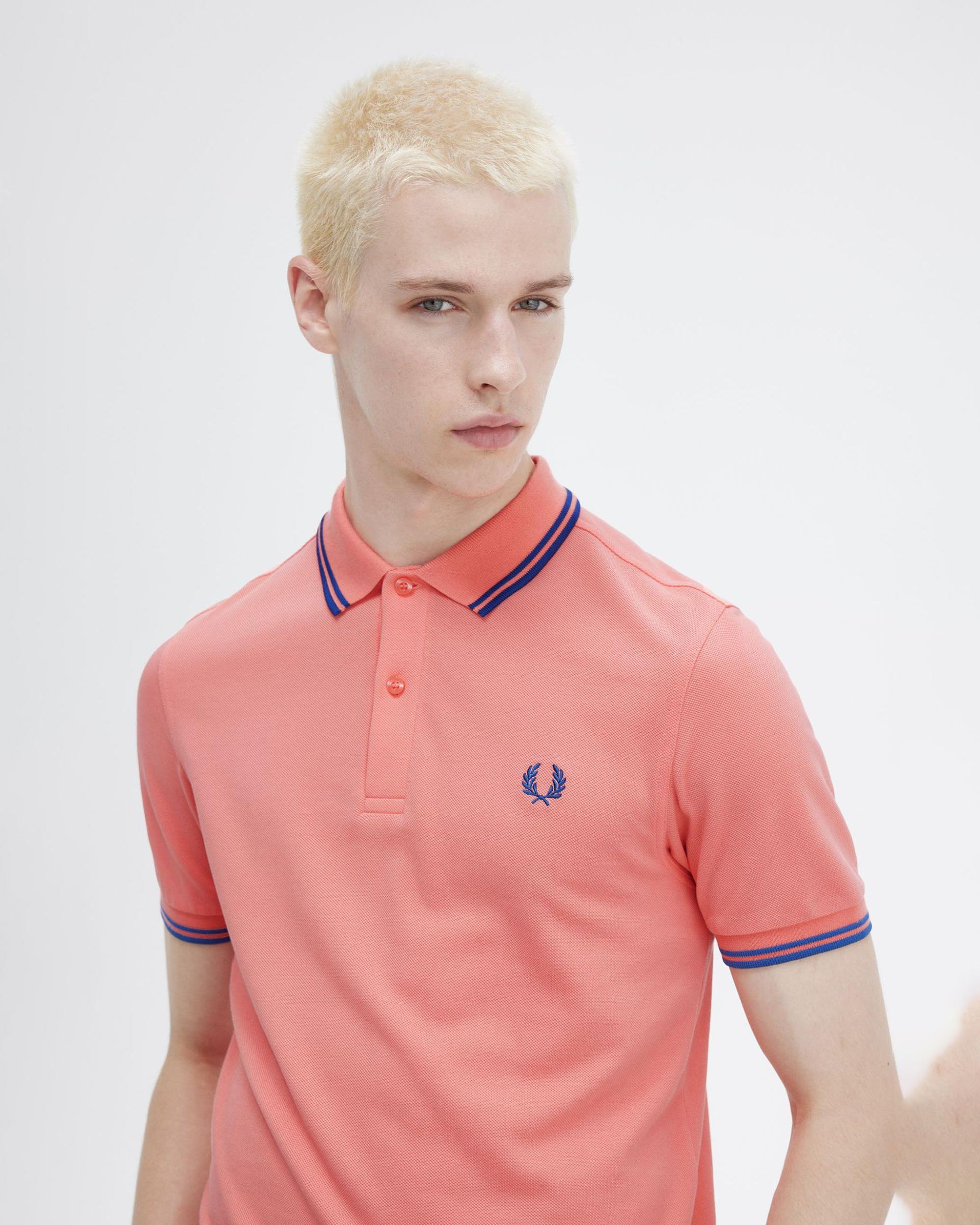 Polo corallo mezza manica con bordino blu royal image