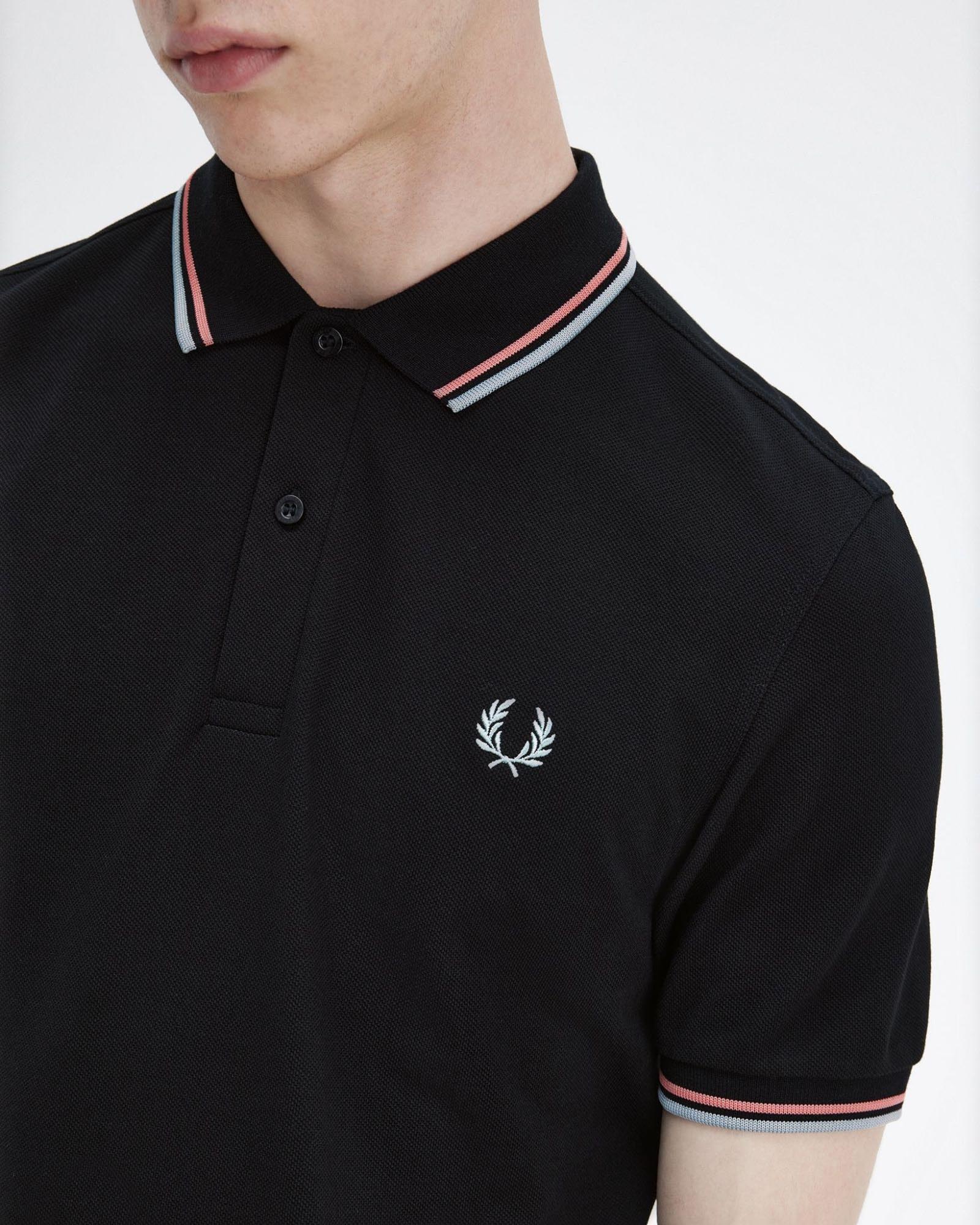 Polo nera mezza manica con bordino corallo e grigio image