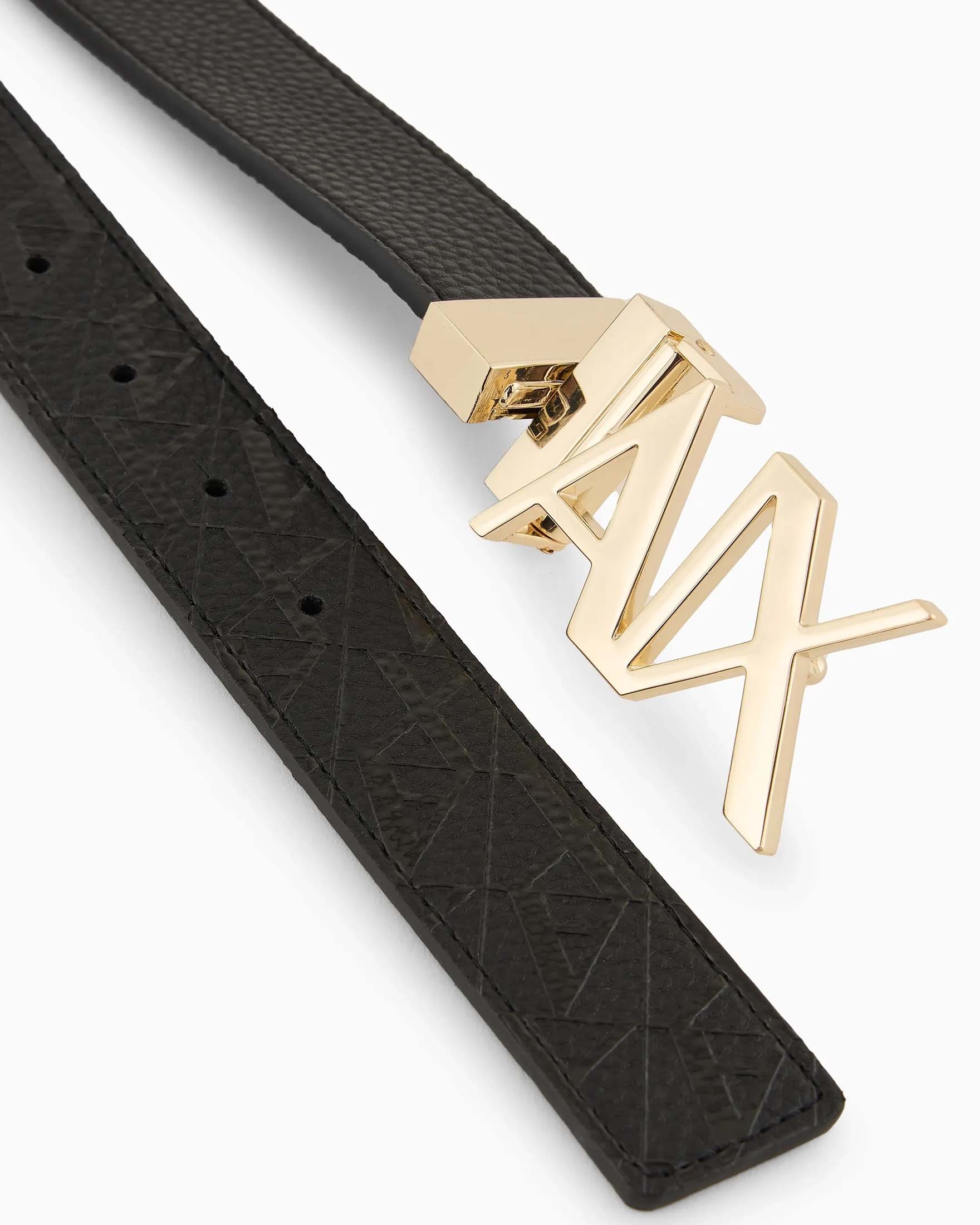 Cintura nera reversibile in similpelle con fibbia dorata e lettering logo impressa su un lato image