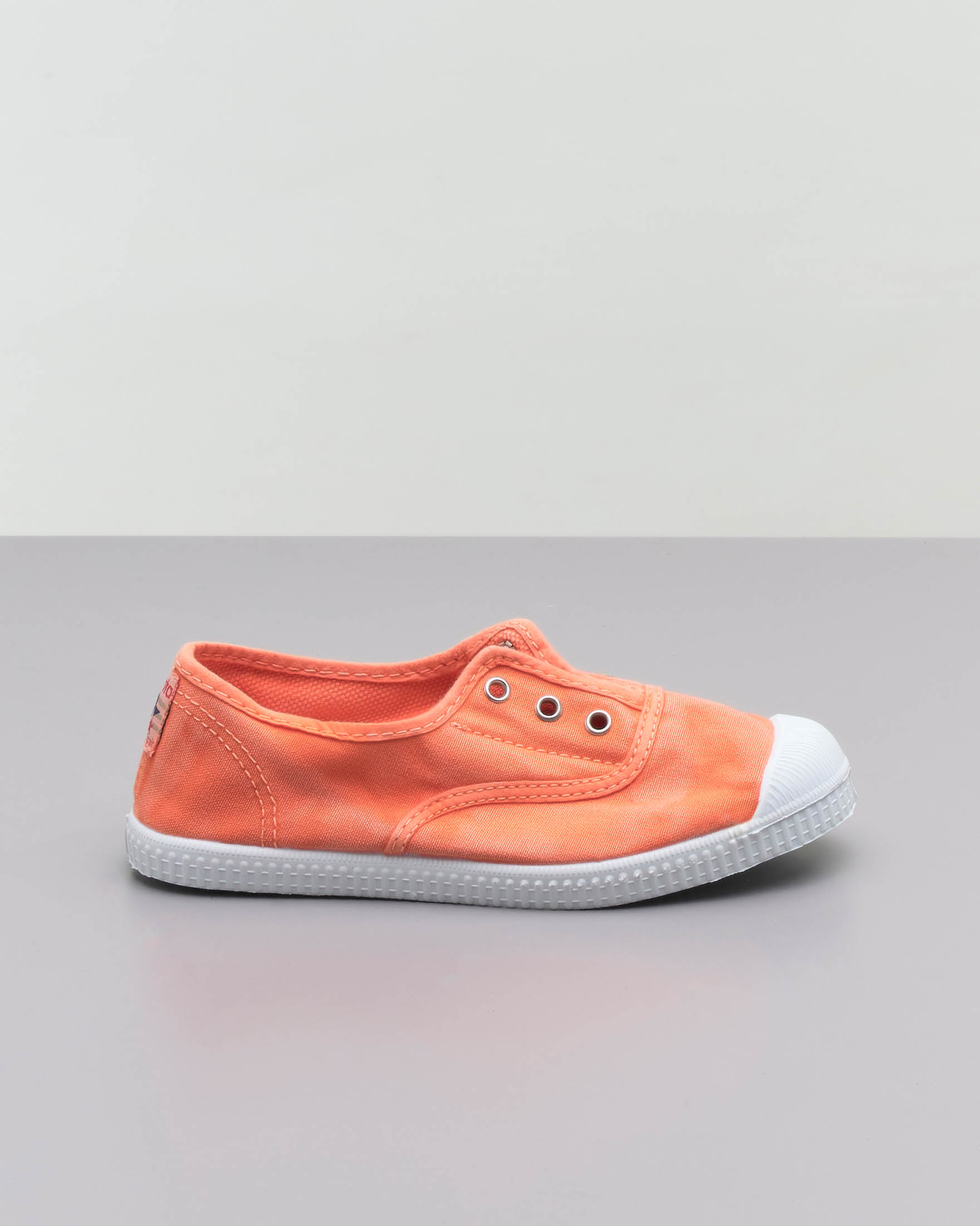 Sneakers slip-on arancioni senza lacci in canvas di cotone effetto stone washed