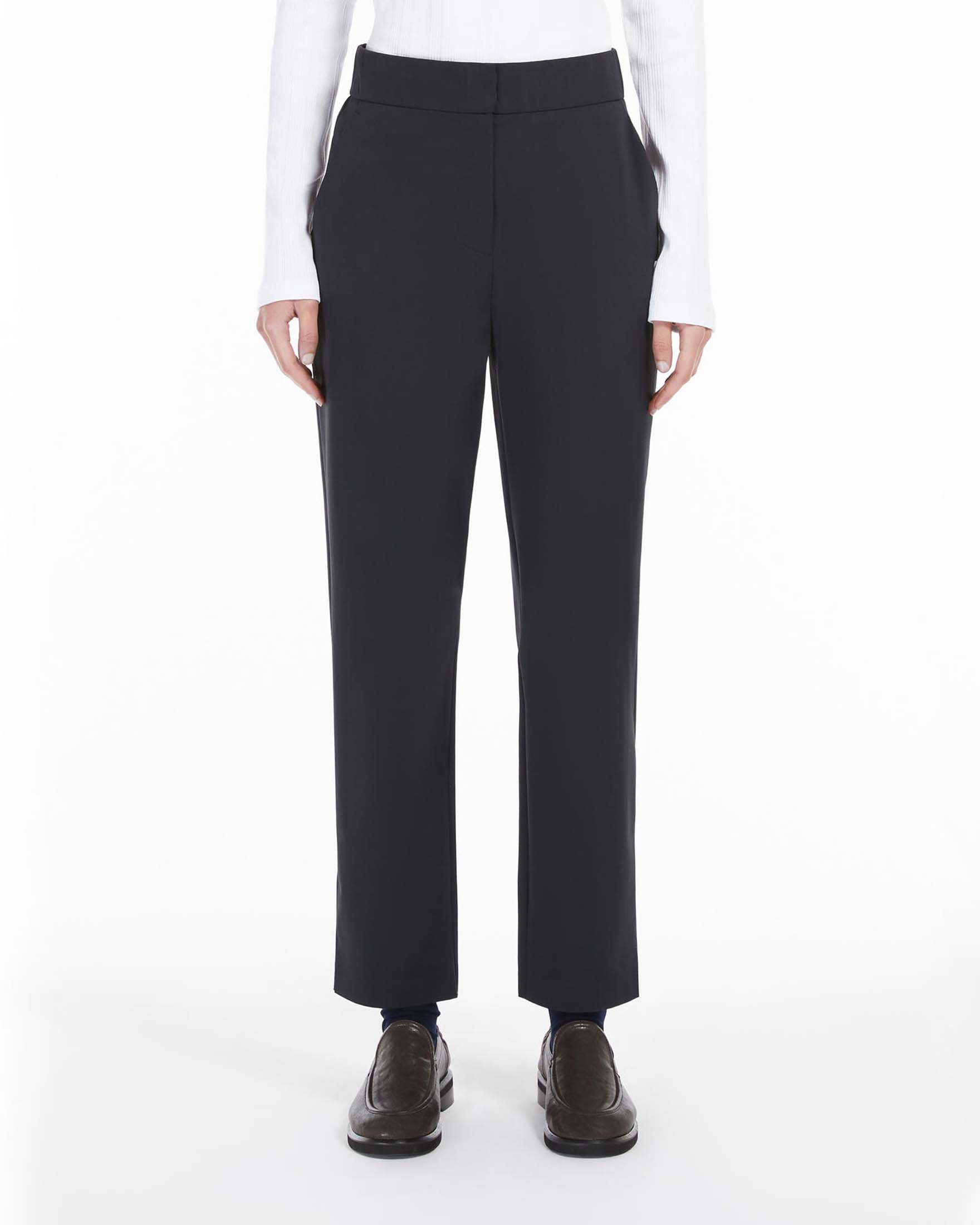 Pantaloni blu slim in jersey tecnico stretch con elastico inserito in vita