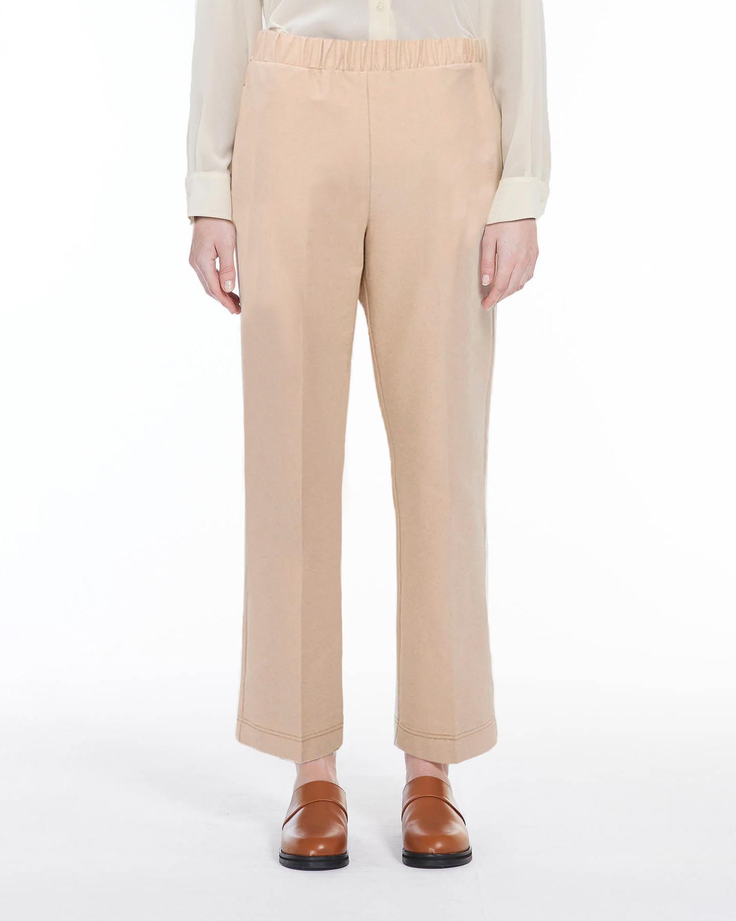 Pantaloni dalla linea semiaderente cropped alla caviglia color cacha in jersey effetto denim