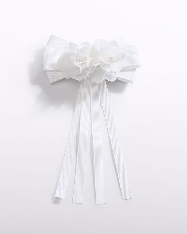 Molletta Abel & Lula con fiocco e fiore bianco applicato
