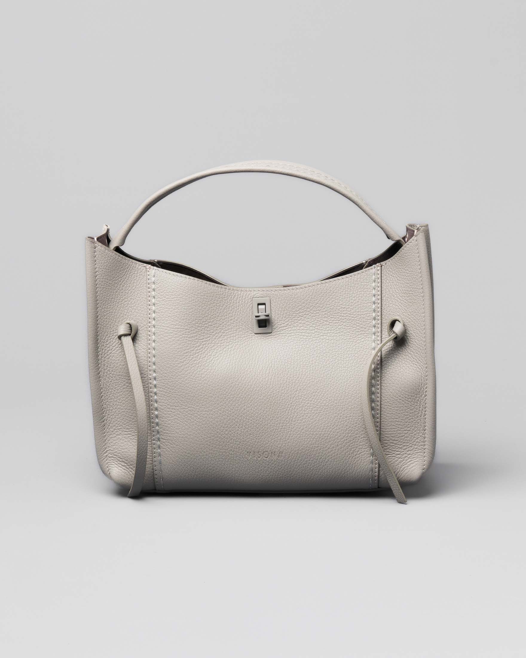 Borsa grigio perla in pelle martellata a trapezio con listini a nodo