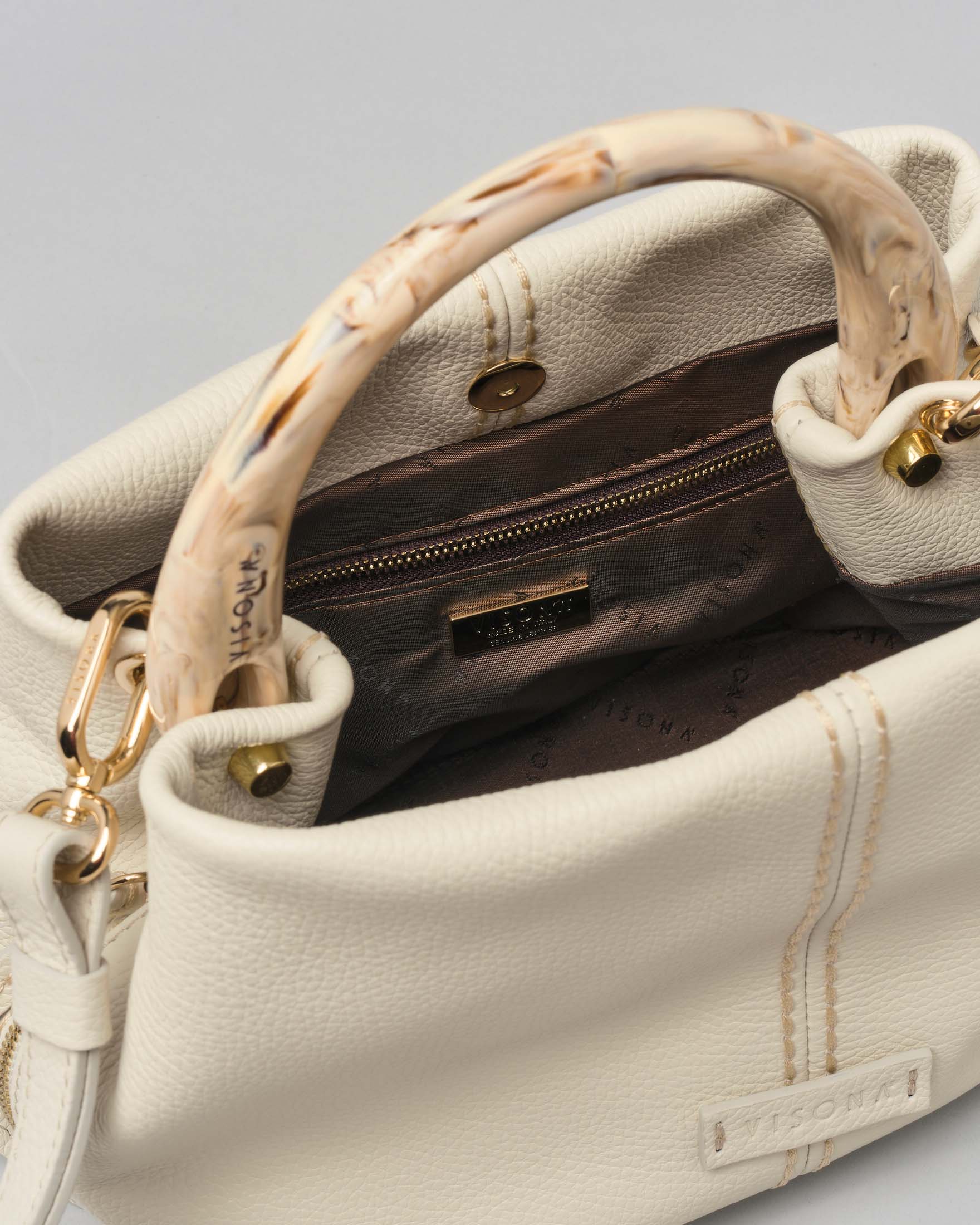 Borsa color latte in pelle martellata misura piccola con manico in osso tono su tono e impunture a vista image