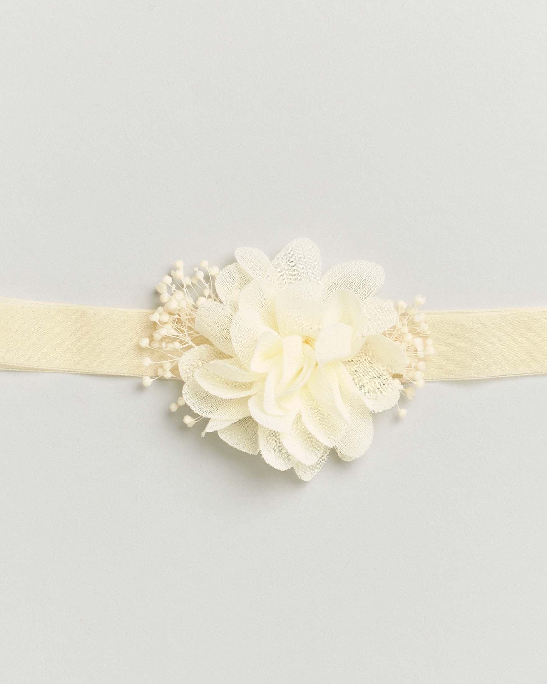 Fascetta color panna con fiore e decorazioni image