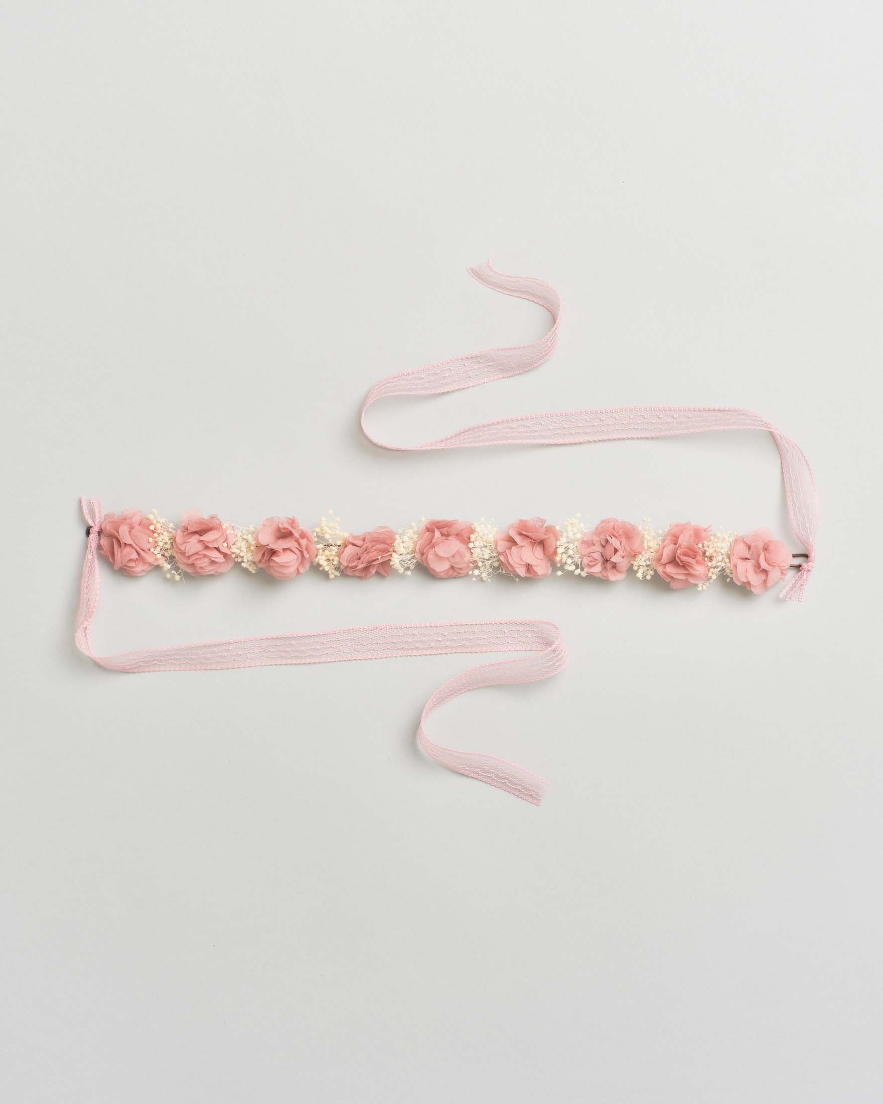 Coroncina con fiori rosa e fiocco
