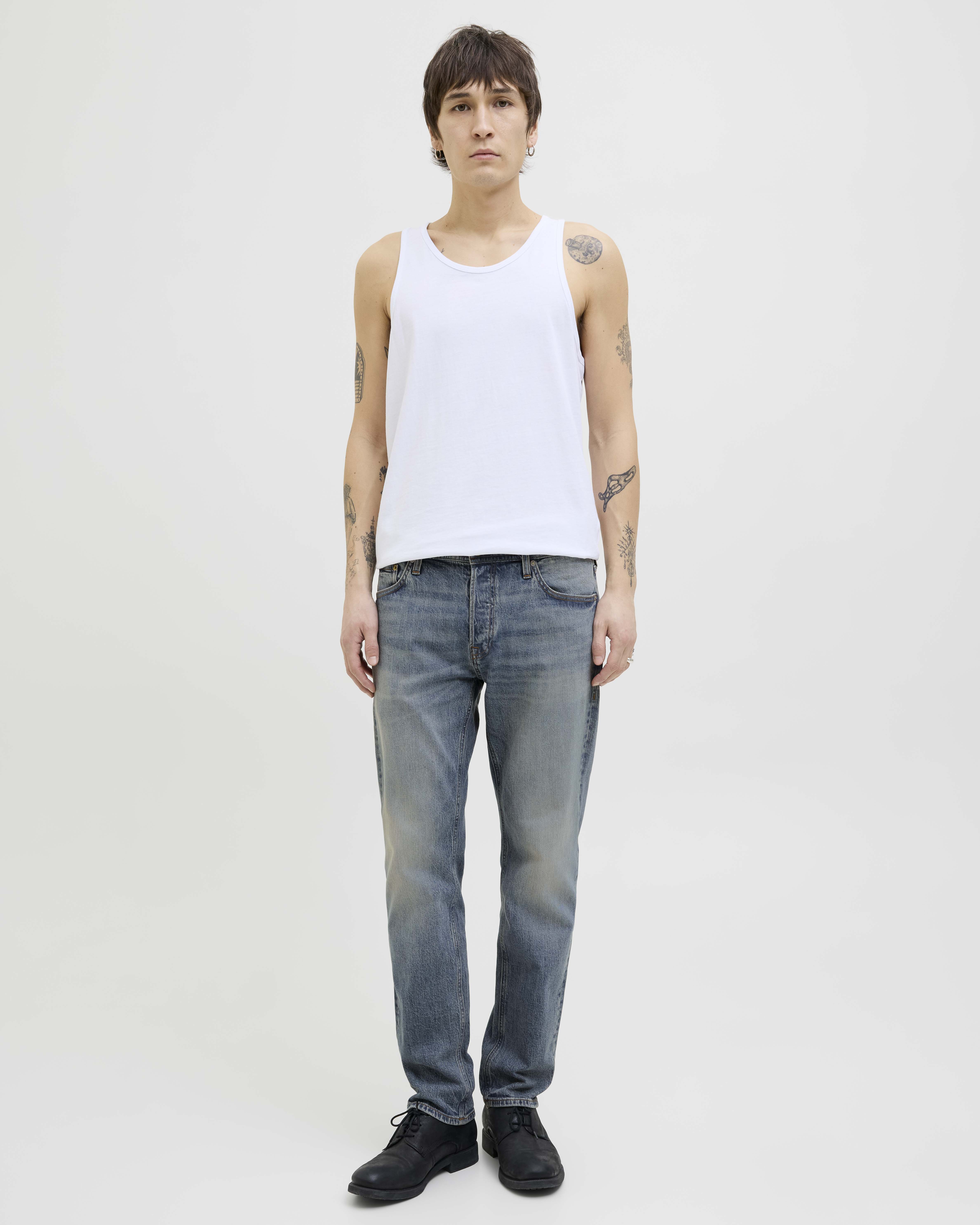 Jeans comfort-fit a vita media in cotone stretch lavaggio medio con ingialliture e baffature