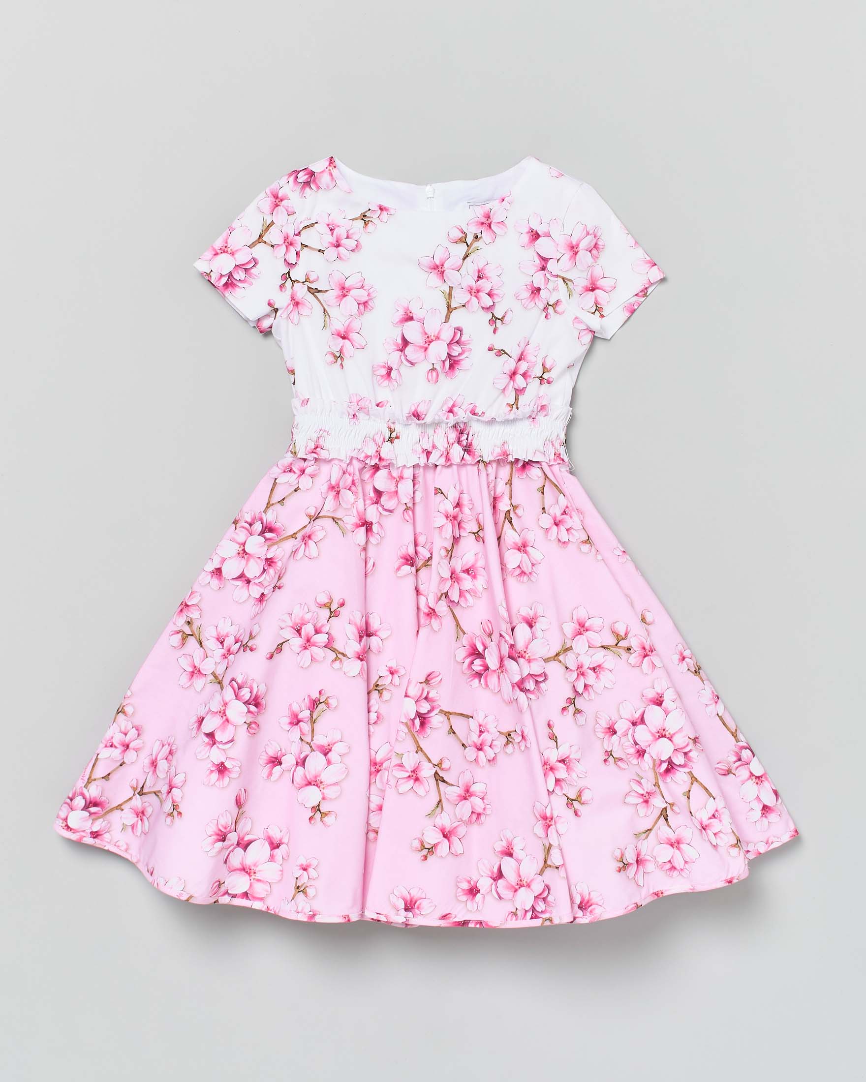 Abito rosa e bianco con fiori di pesco